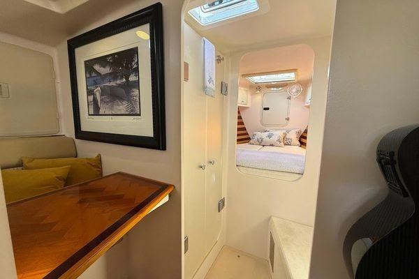 Interior of 2011 Reliance 44 yacht featuring cozy cabin and elegant wooden table.