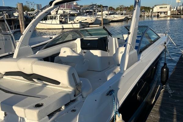 2022 Four Winns HD3 OB RS boat docked at marina, featuring sleek design and spacious seating.