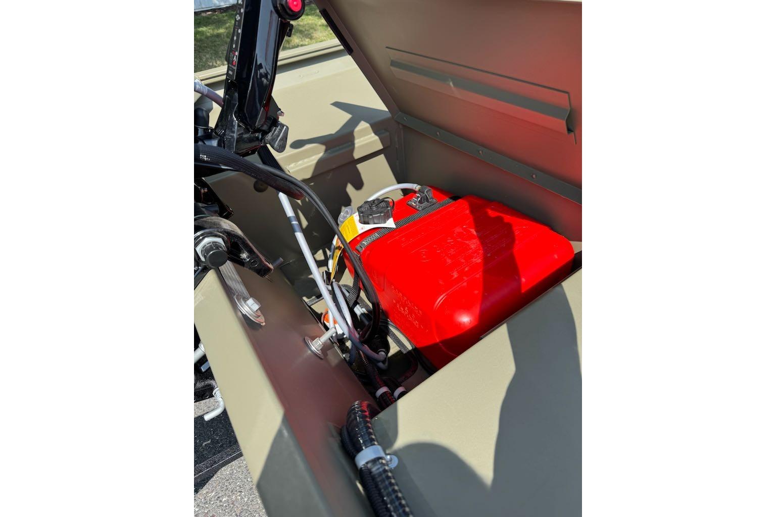 2026 Tracker Grizzly 1654 T Sportsman boat interior with red fuel tank.