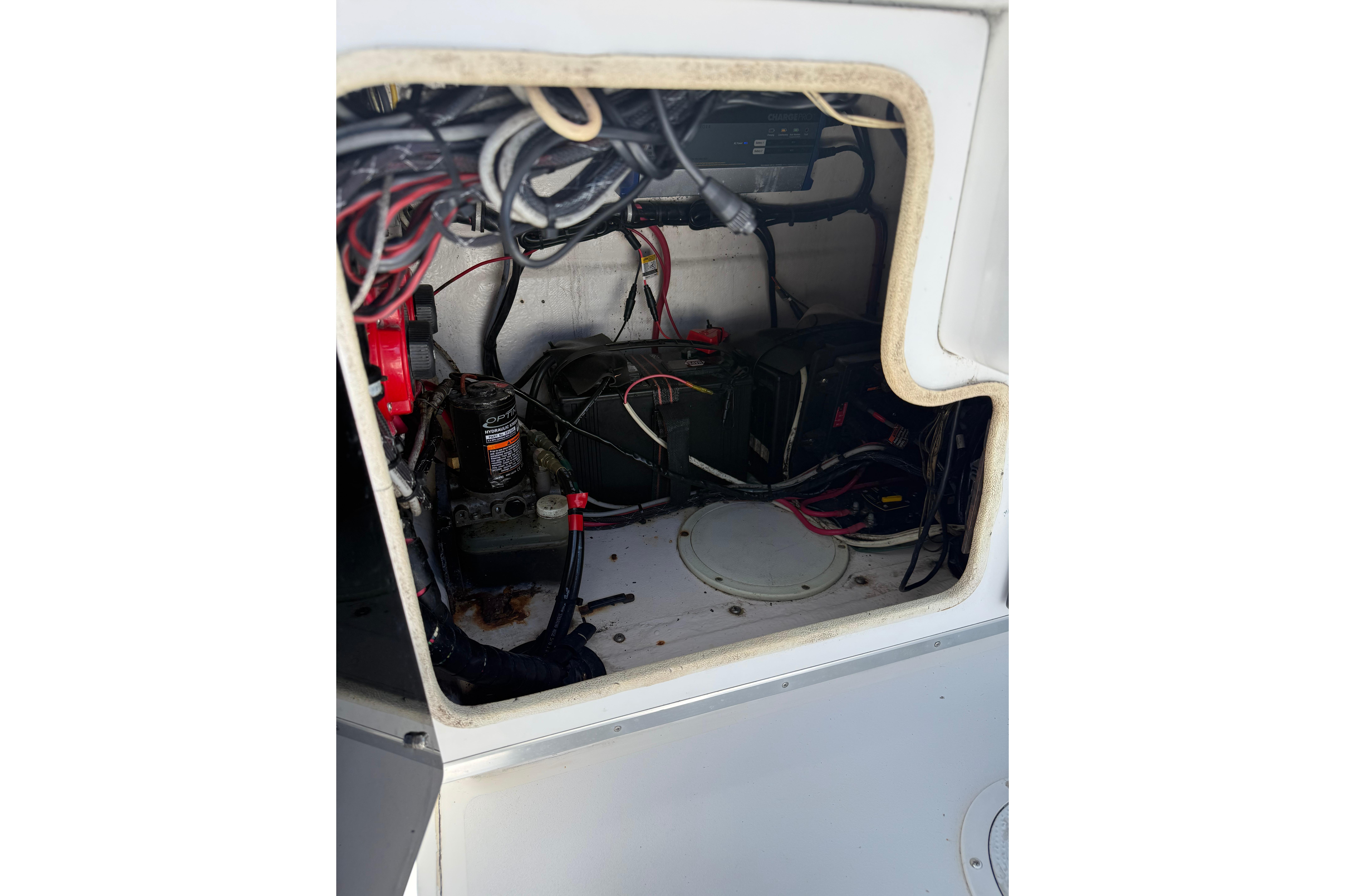 Interior view of a 1992 Intrepid 289 Center Console boat's wiring and battery compartment.