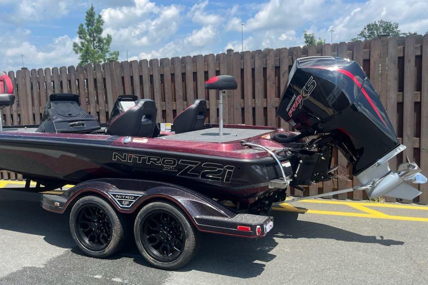 2026 Nitro Z21 XL Pro boat with powerful outboard motor, parked on a trailer.