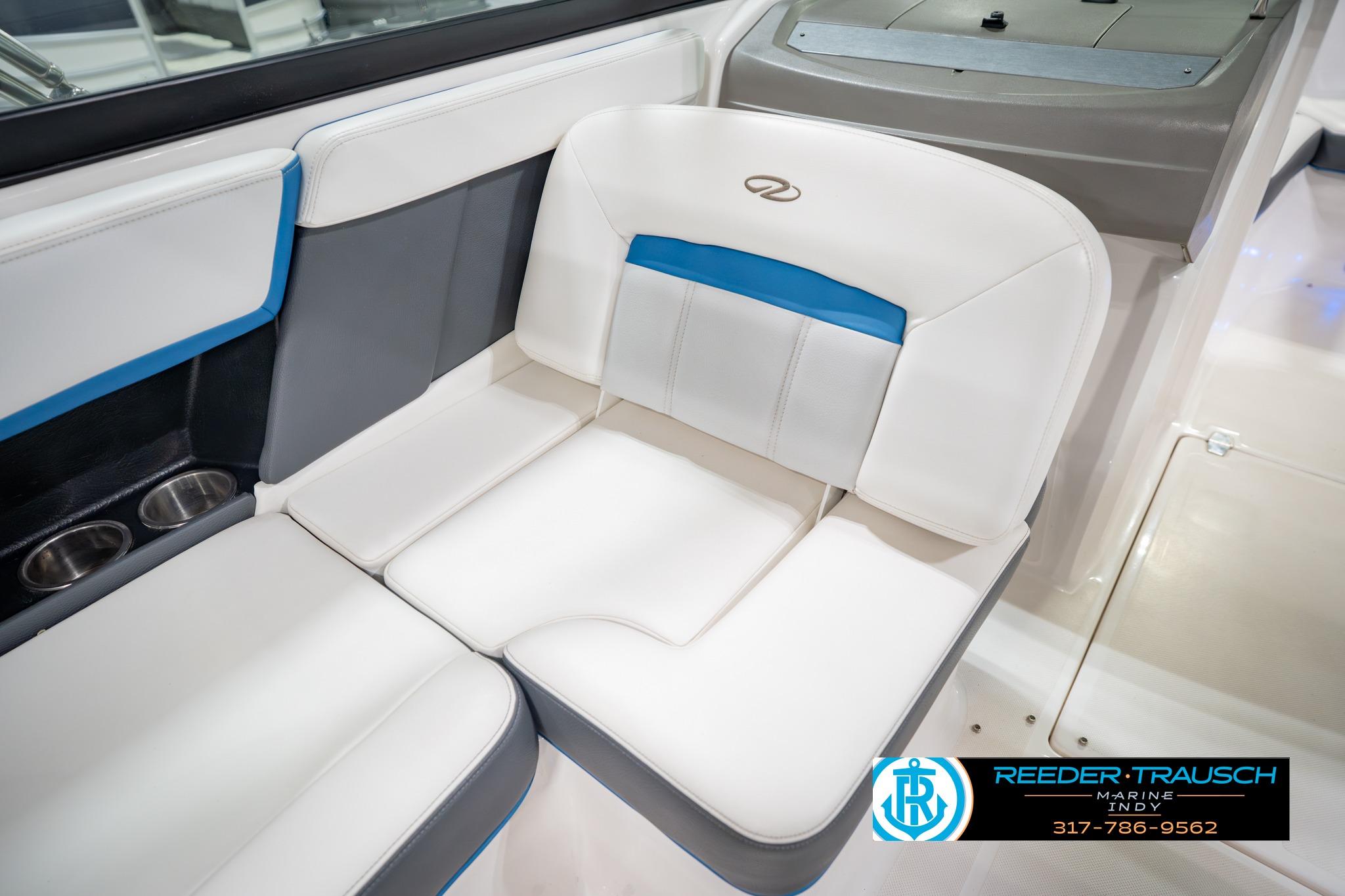 2015 Regal 2000 ESX Bowrider interior seating with cup holders, featuring white and blue upholstery.