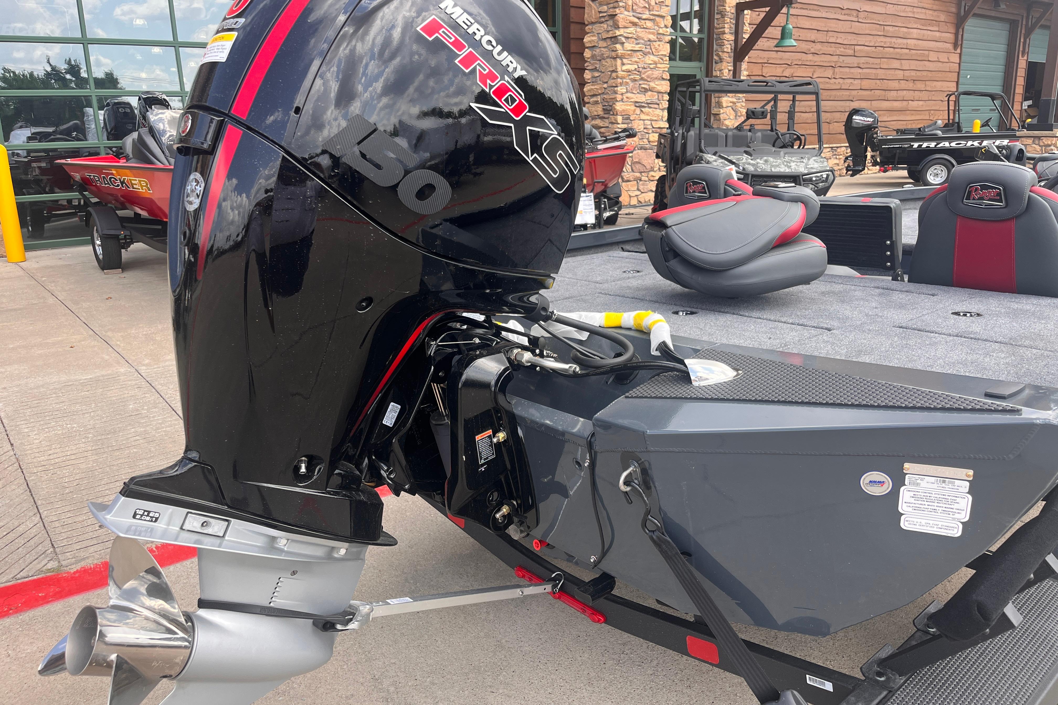 2026 Ranger RT198P boat with Mercury Pro XS 150 engine, parked outdoors.
