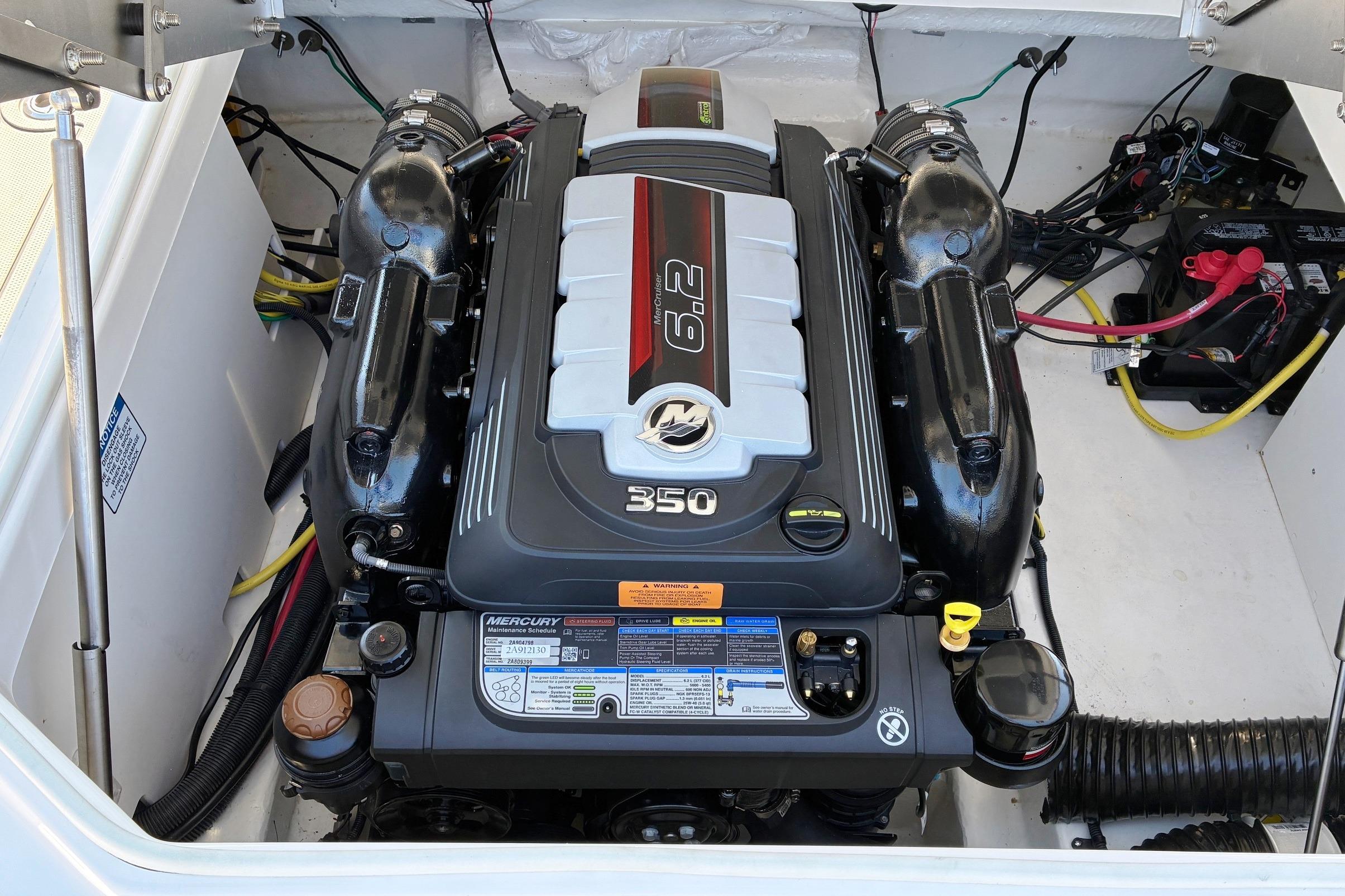 2025 Chaparral 267 SSX boat engine compartment with 6.2L Mercury 350 engine.
