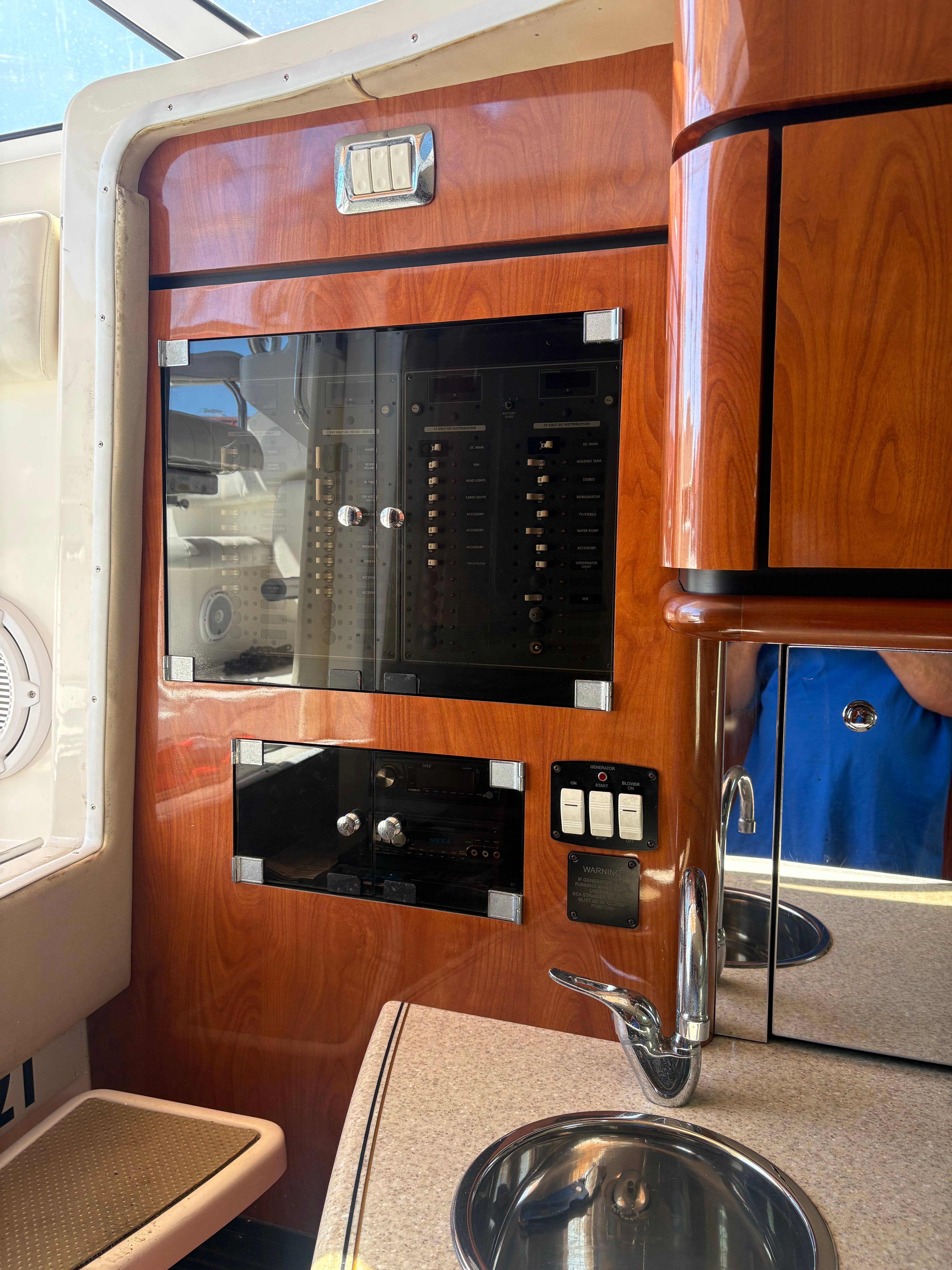 Interior of 2009 Fountain 33 Sportfish Cruiser with wood paneling.