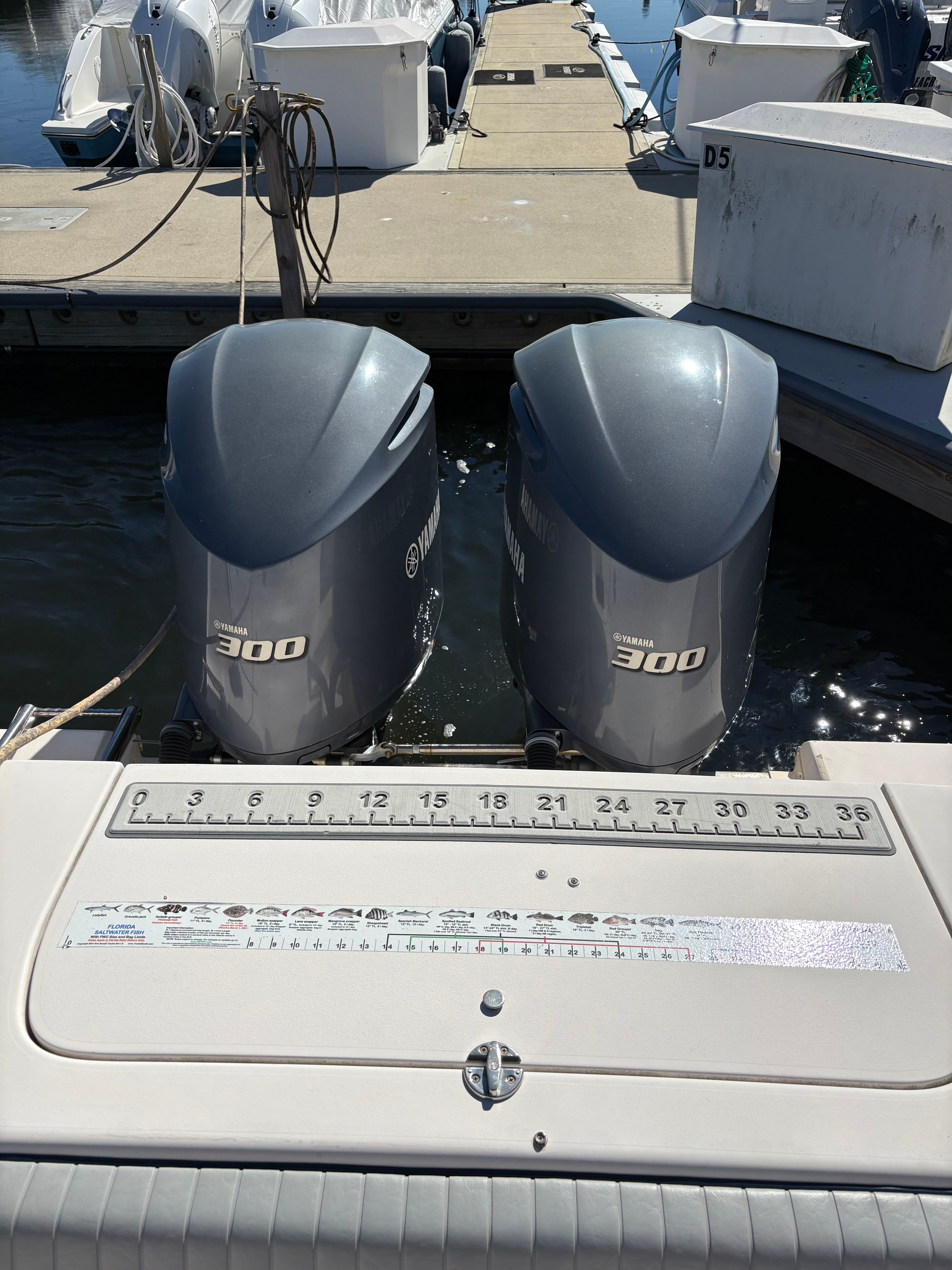 Grady-White Chesapeake 290 boat with twin Yamaha 300 engines at dock.