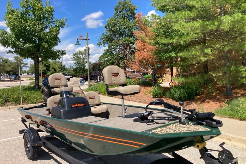 2026 Tracker Bass Tracker Classic Limited boat parked outdoors on a sunny day.