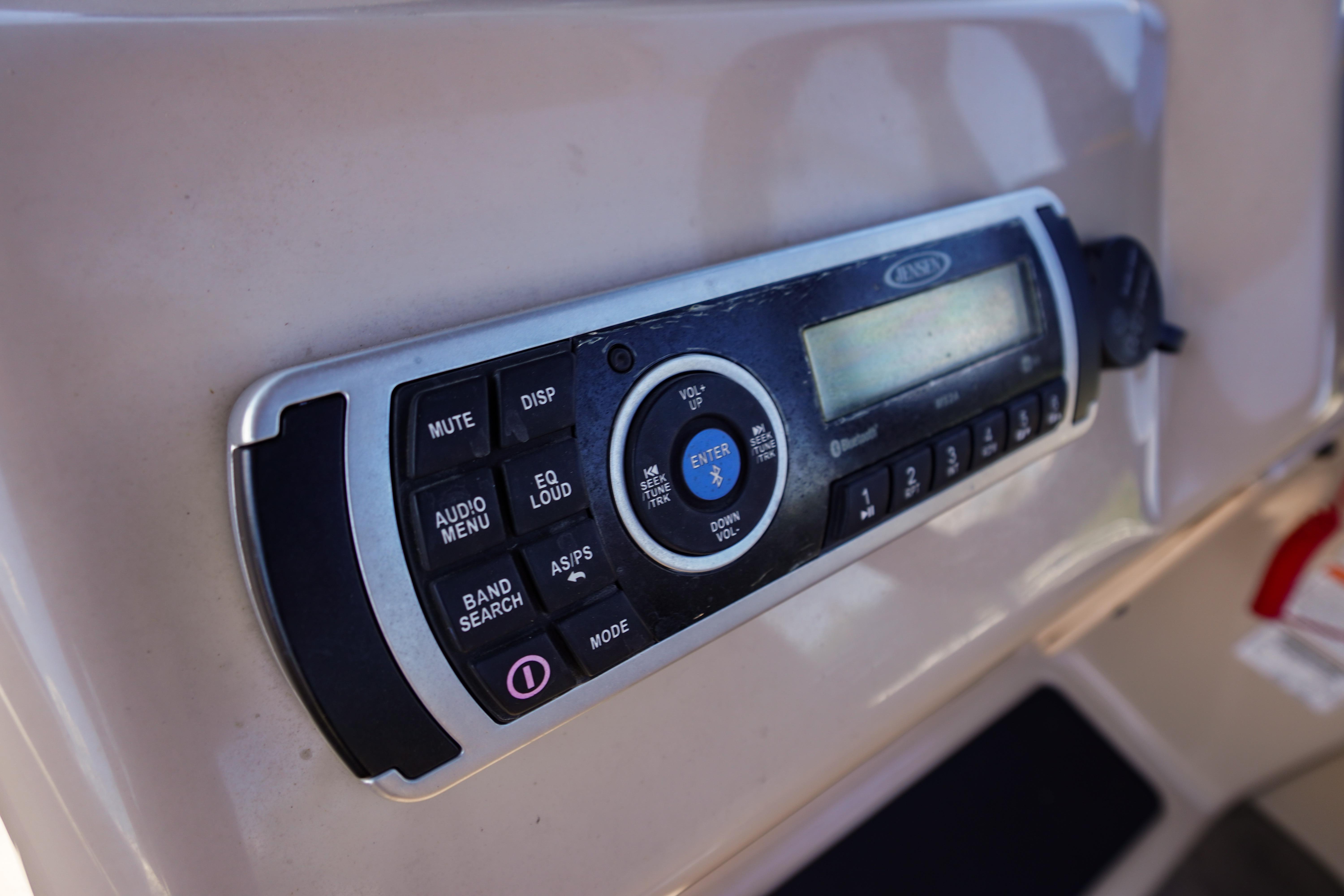 Close-up of a 2019 SUNTRACKER Fishin' Barge 22 DLX audio control panel.