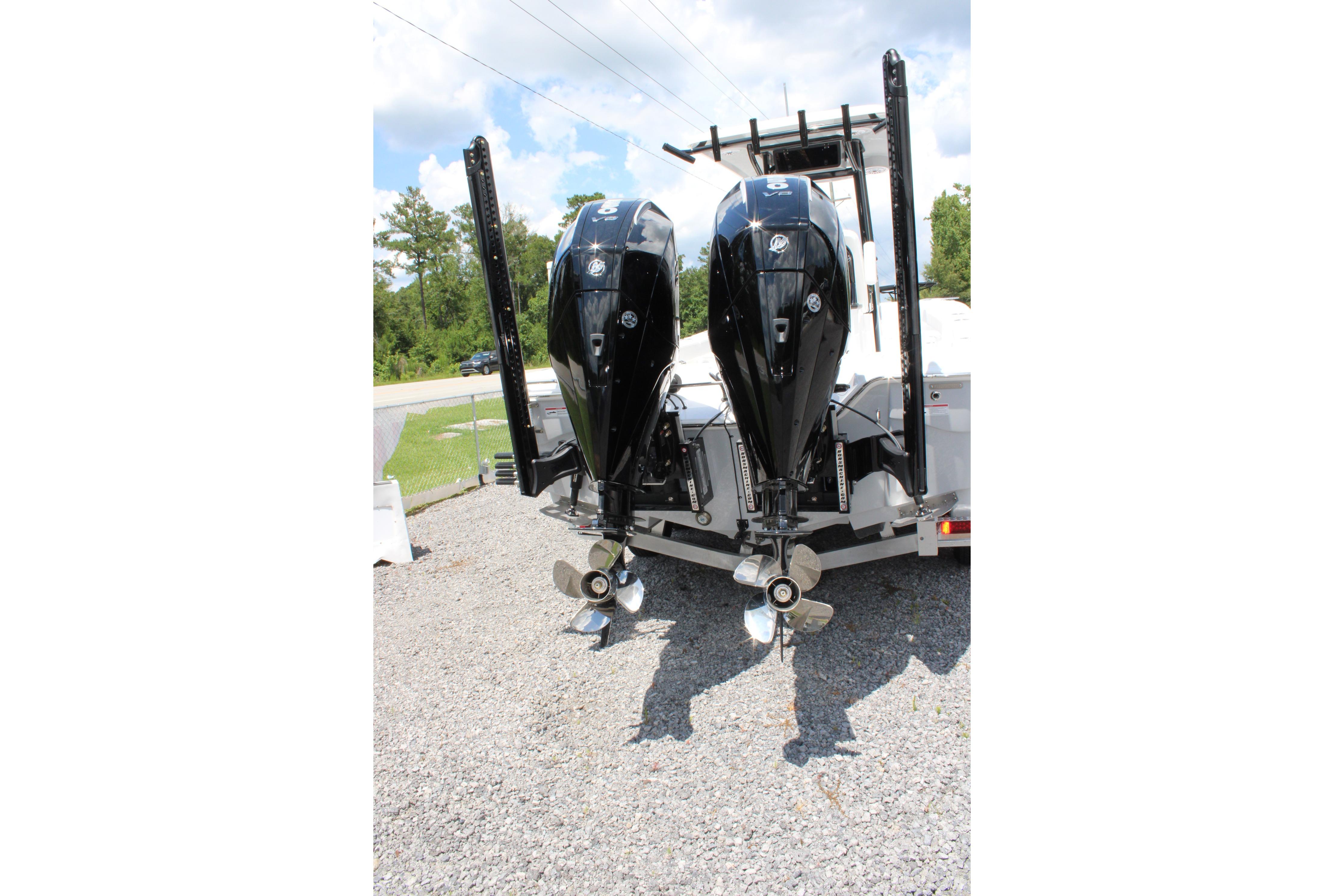 2027 Blazer Bay Makaira 2800 boat with dual outboard motors on a trailer.