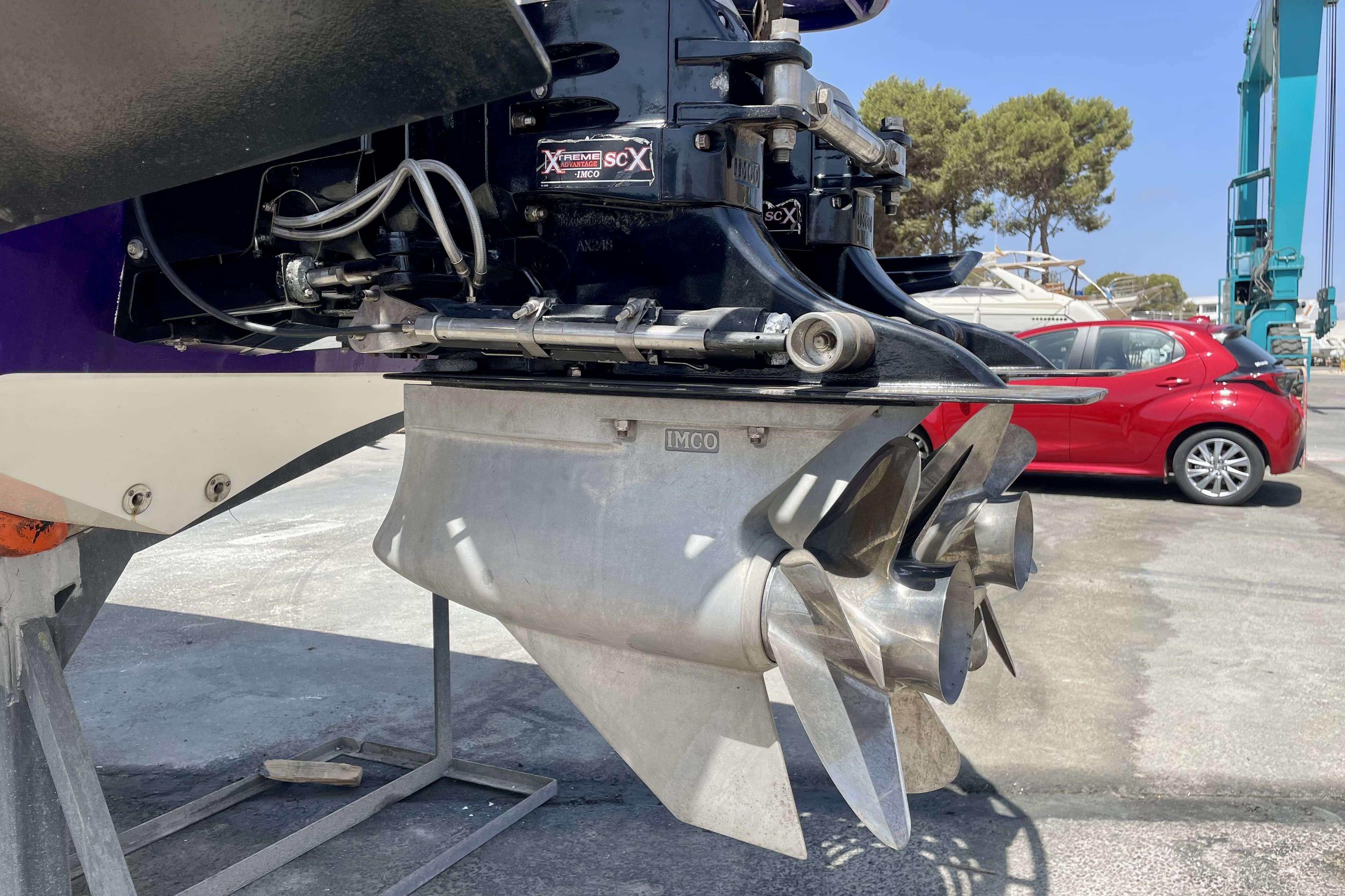 Close-up of 2004 Cigarette 36' Gladiator boat propeller and engine components.