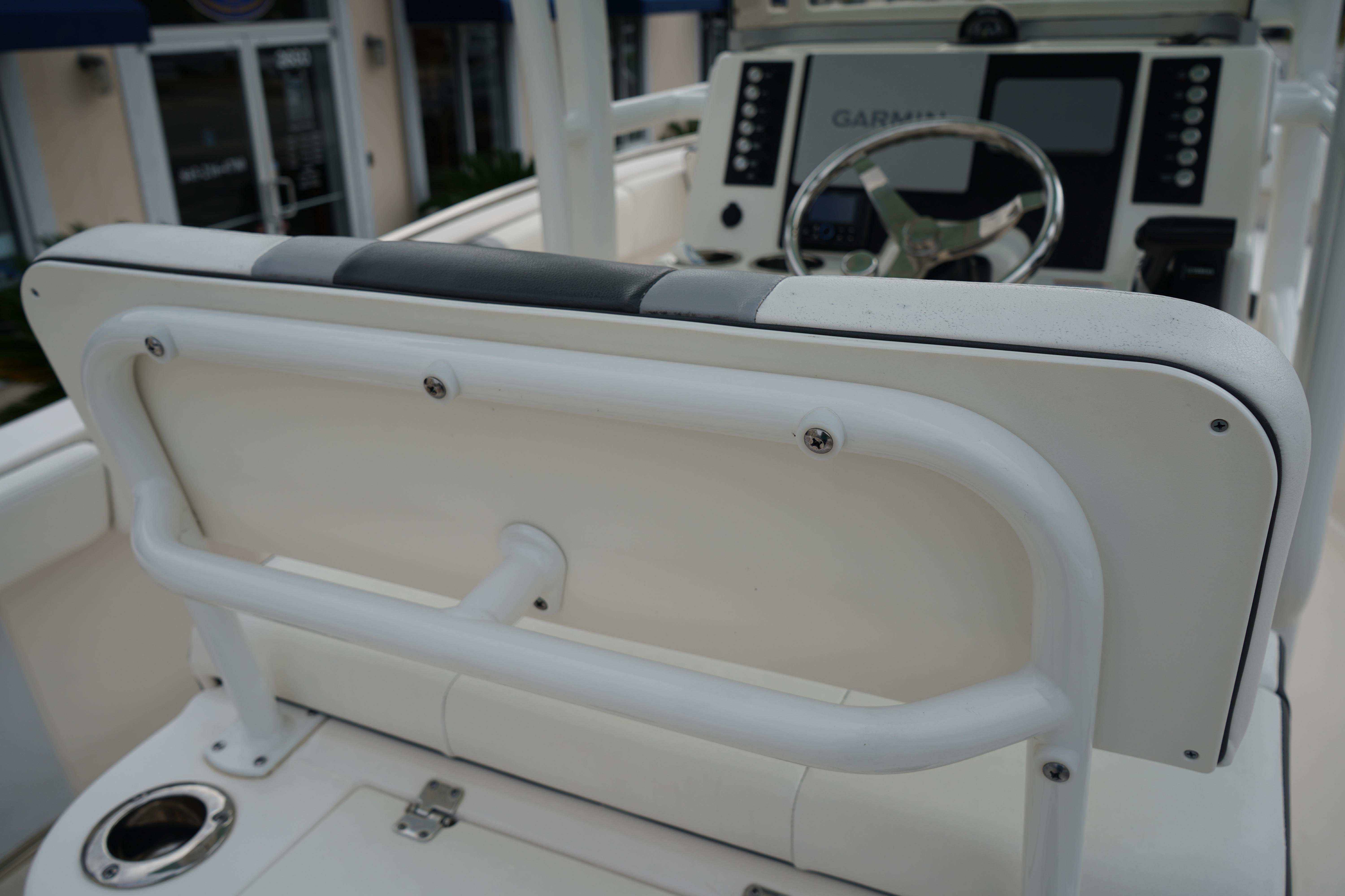 2023 Robalo R222 Center Console helm with Garmin navigation system and steering wheel.