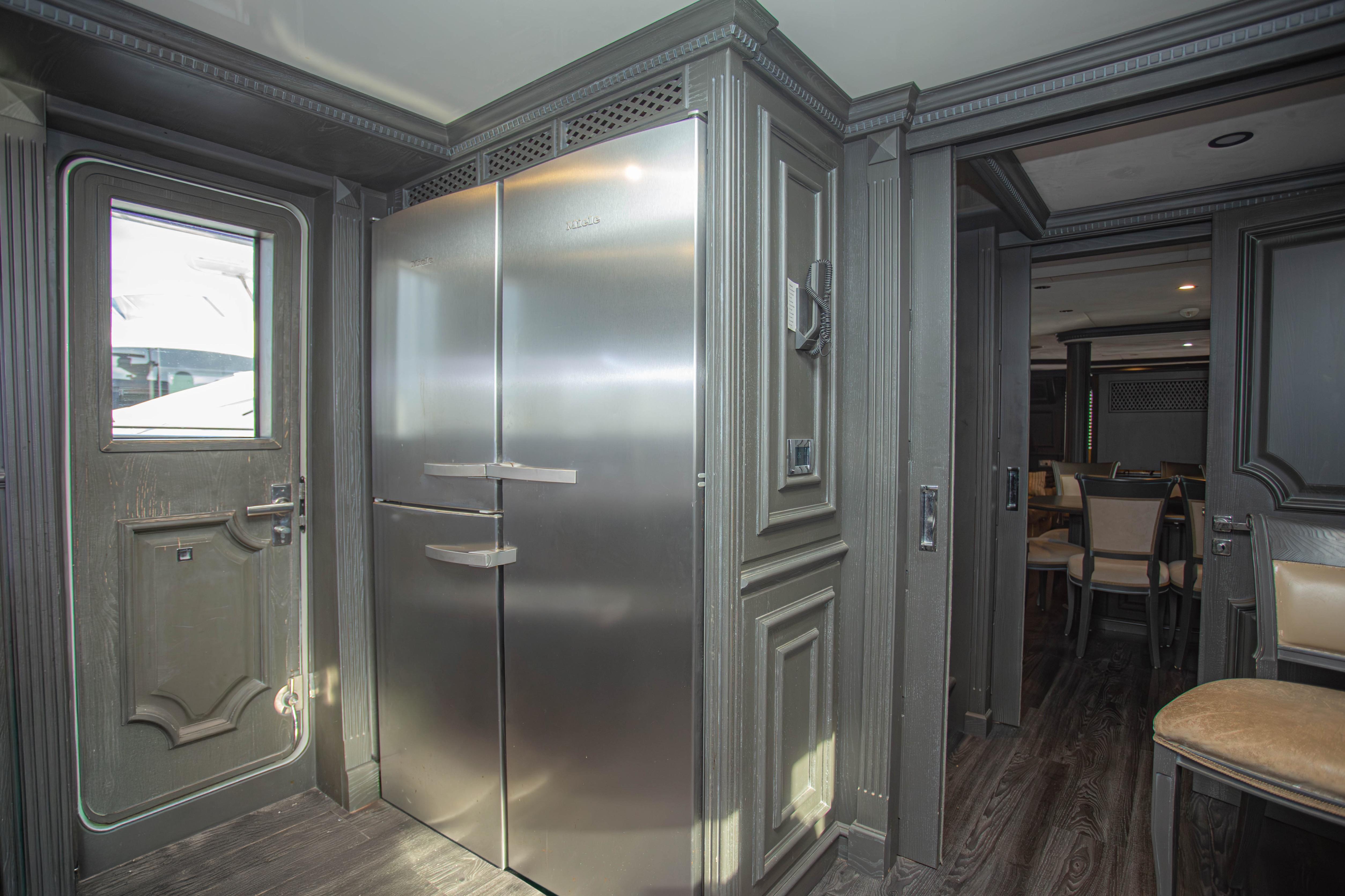 Luxurious interior of 2014 Fifth Ocean Yachts 24m Explorer Yacht with modern kitchen design.