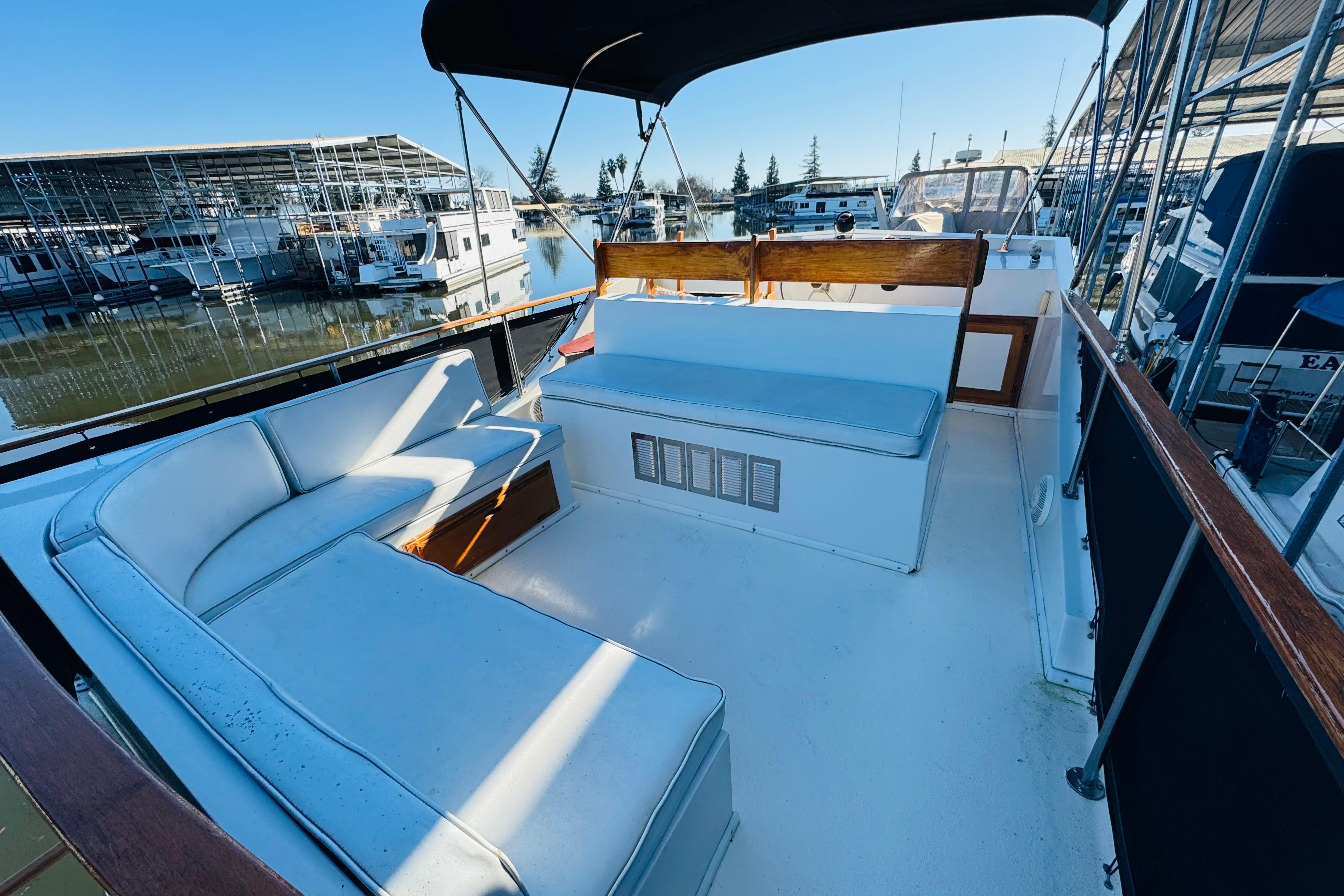 1978 Californian 42 LRC yacht deck with cushioned seating, docked at marina.