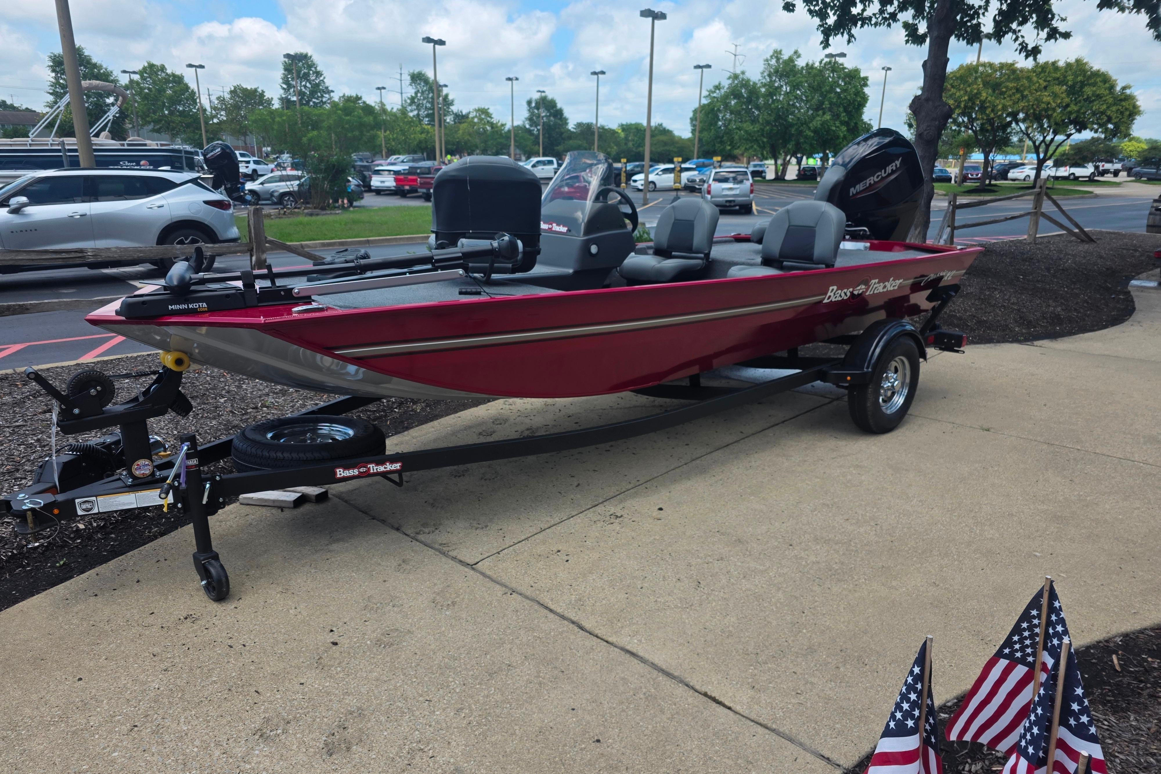 2026 Tracker Bass Tracker Classic XL boat on display in a parking lot setting.