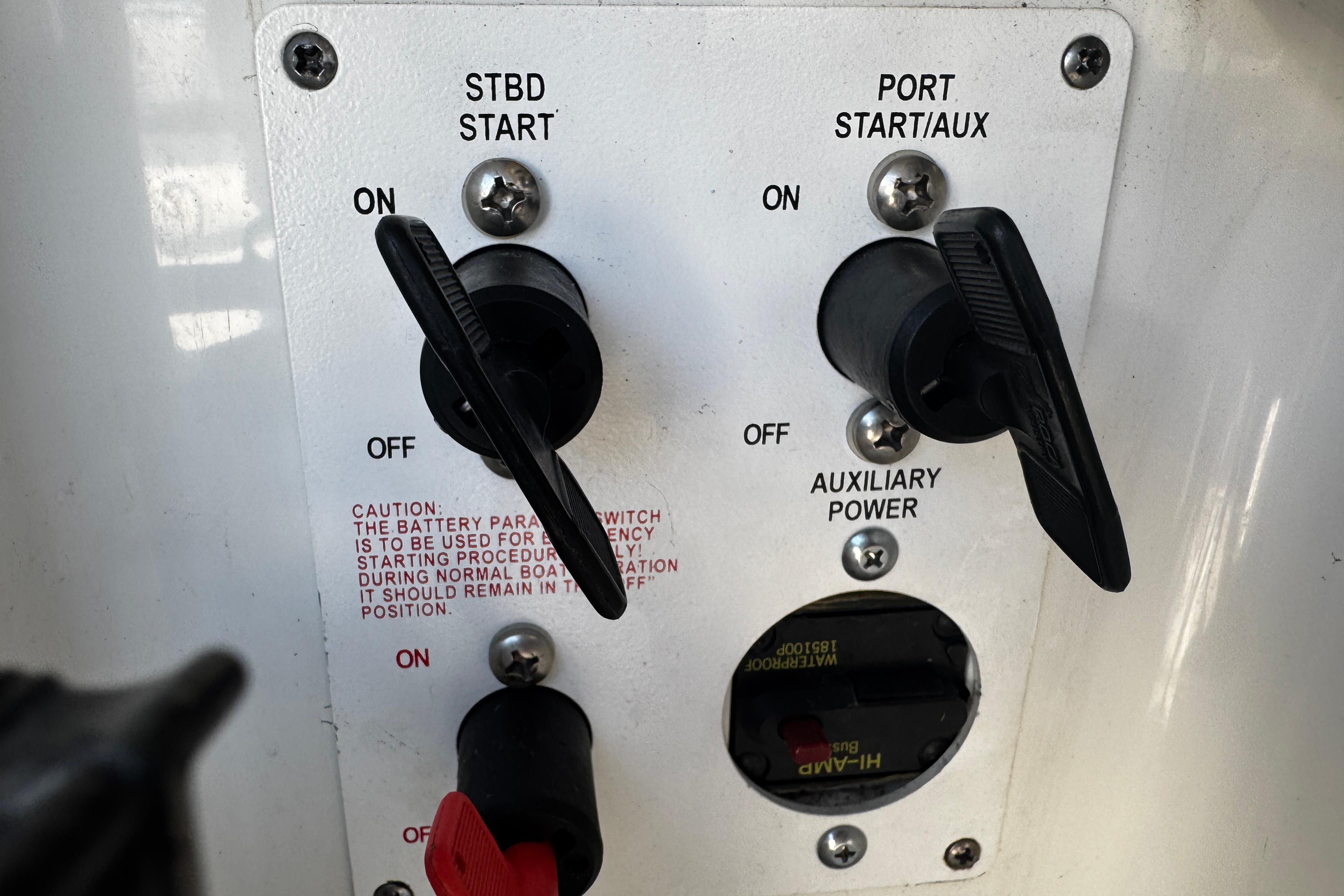 Control panel of a 2004 Formula 280 Sun Sport boat with start switches and auxiliary power.