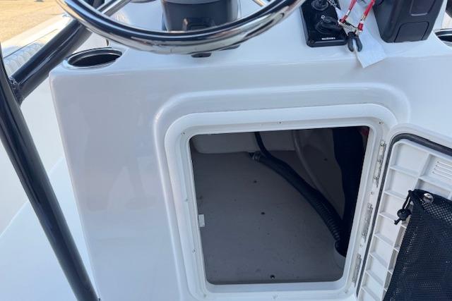 2026 Carolina Skiff 21 LS boat console with open storage compartment.