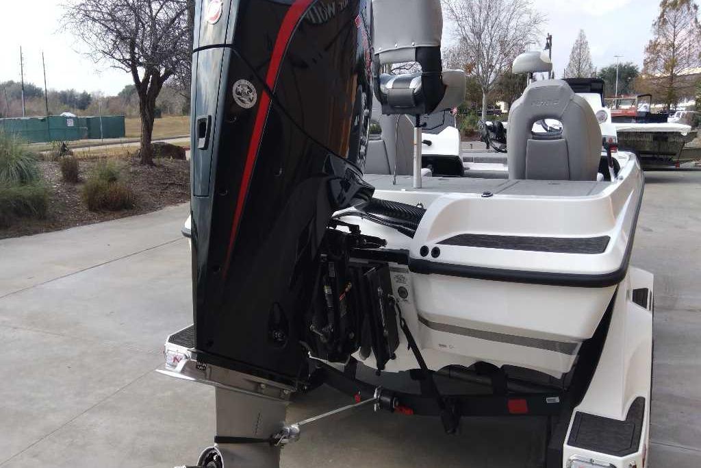 2026 Nitro Z19 XL boat with powerful outboard motor, parked outdoors.