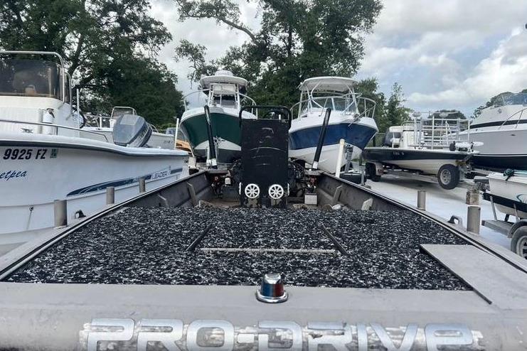 2016 Pro-Drive X Series 20' boat in a marina, surrounded by other vessels.