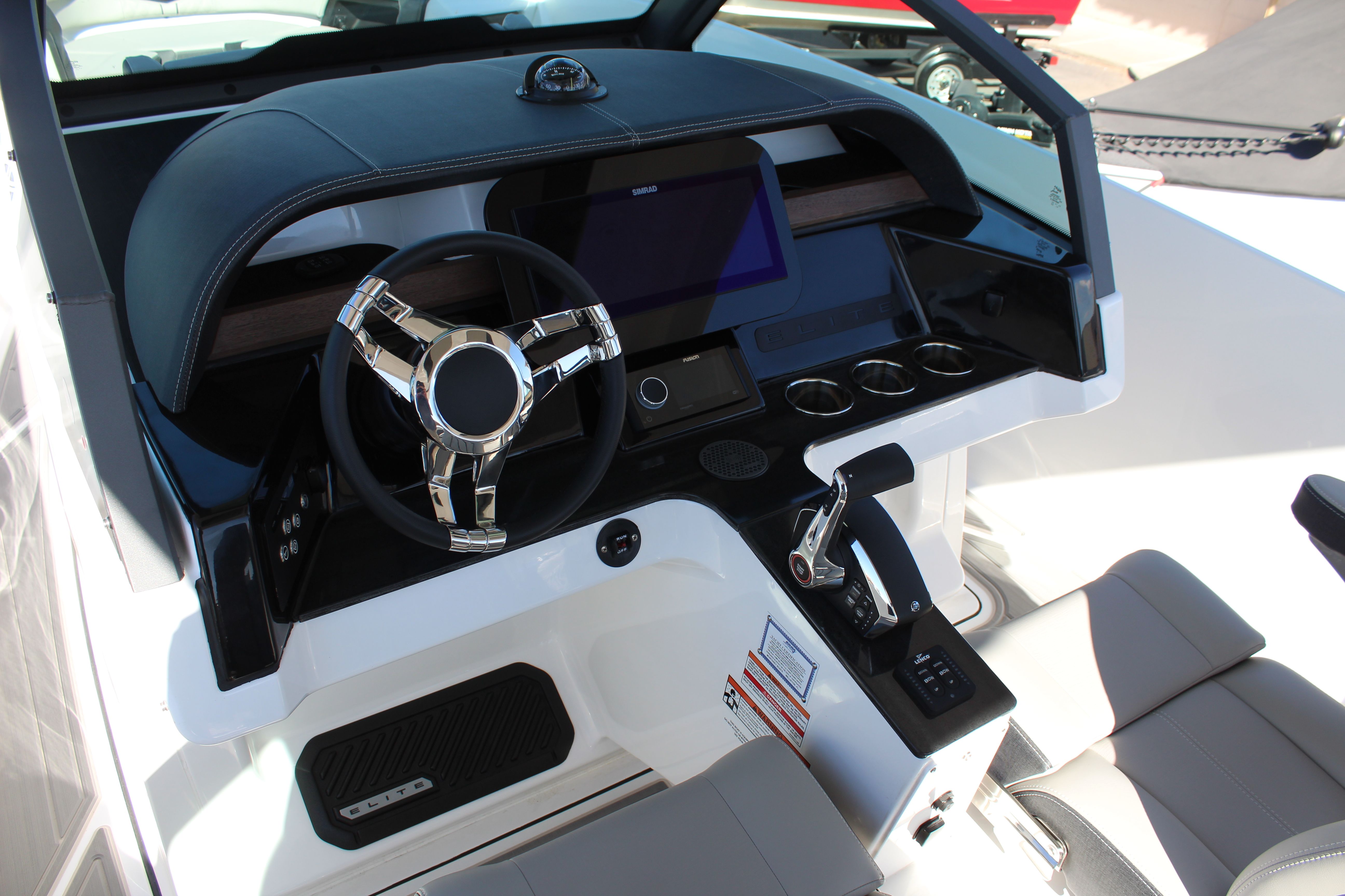 2025 Monterey Elite 27 OB cockpit with modern steering wheel and display.