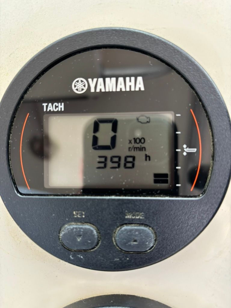 Close-up of a Yamaha tachometer showing 398 operating hours.