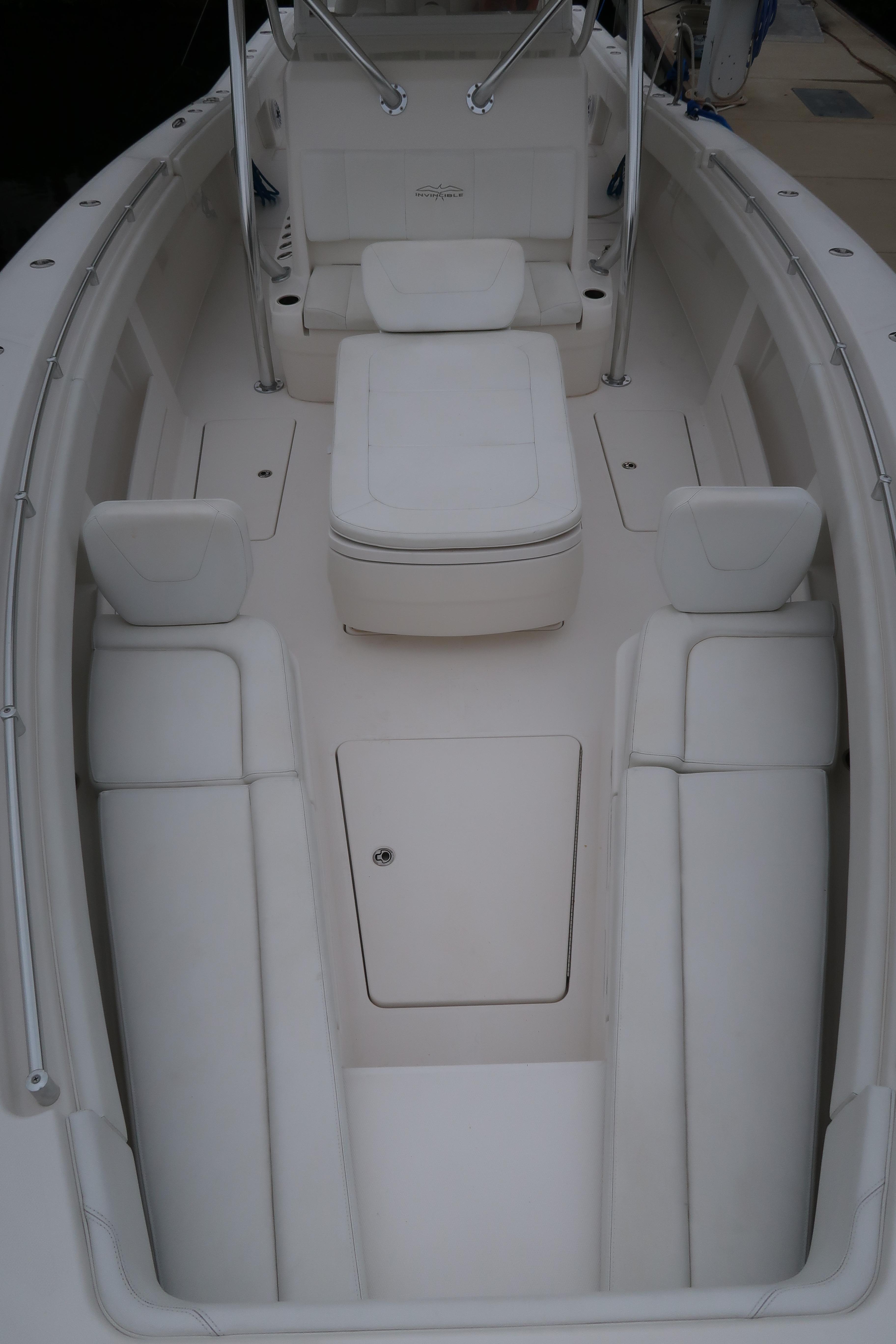 2016 Invincible 42 Open Fisherman boat interior with white seating and storage.