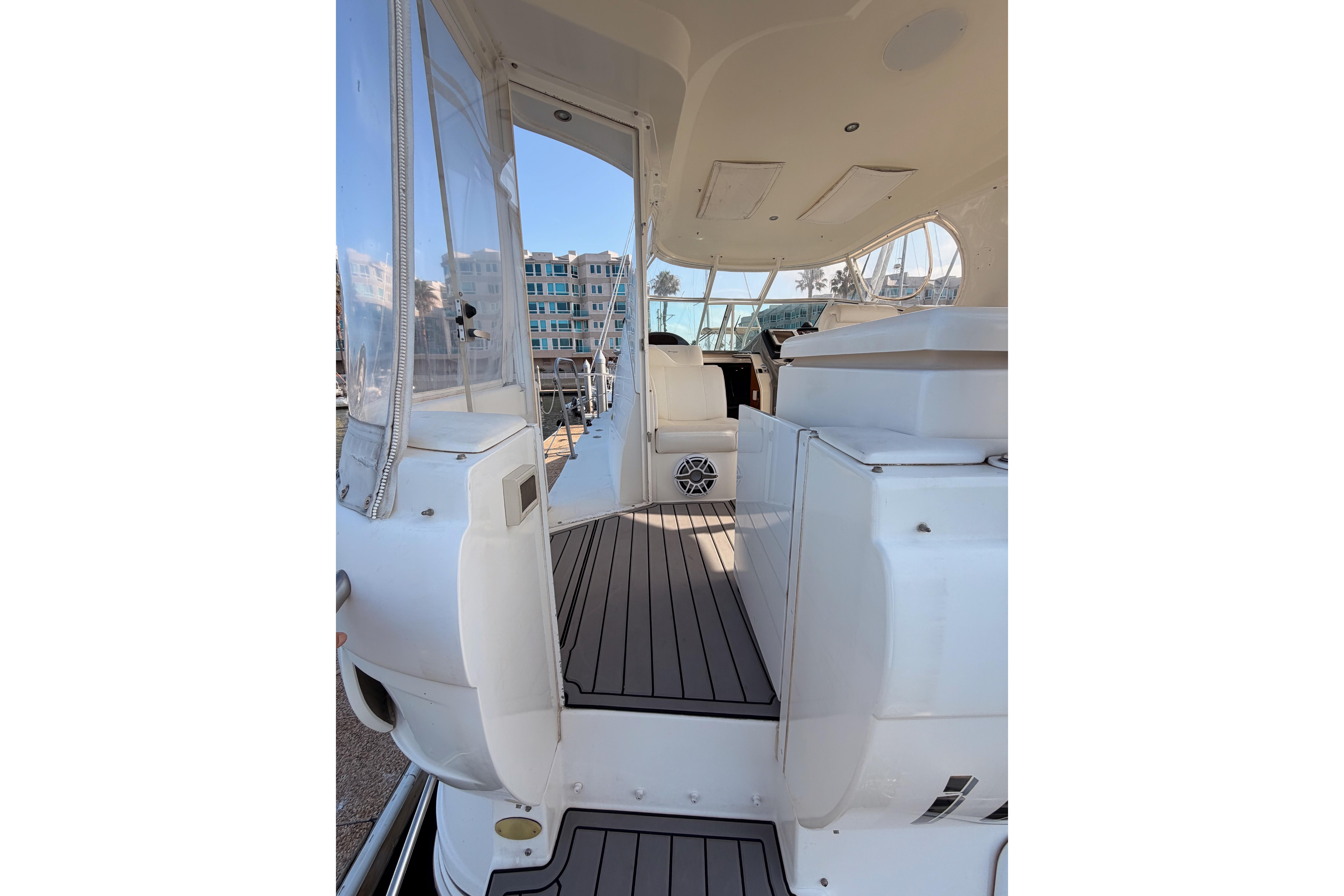 2005 Cruisers Yachts 405 Express Motoryacht interior with sleek white design and spacious layout.