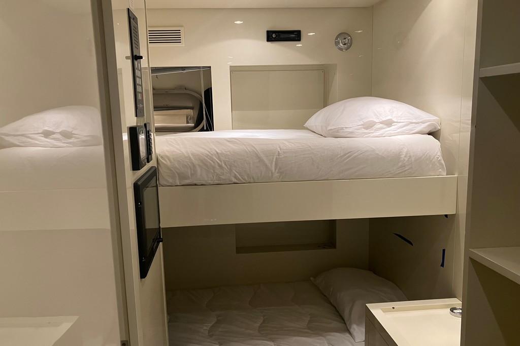 Compact cabin with bunk beds in 2008 Arno Leopard 31 yacht interior.