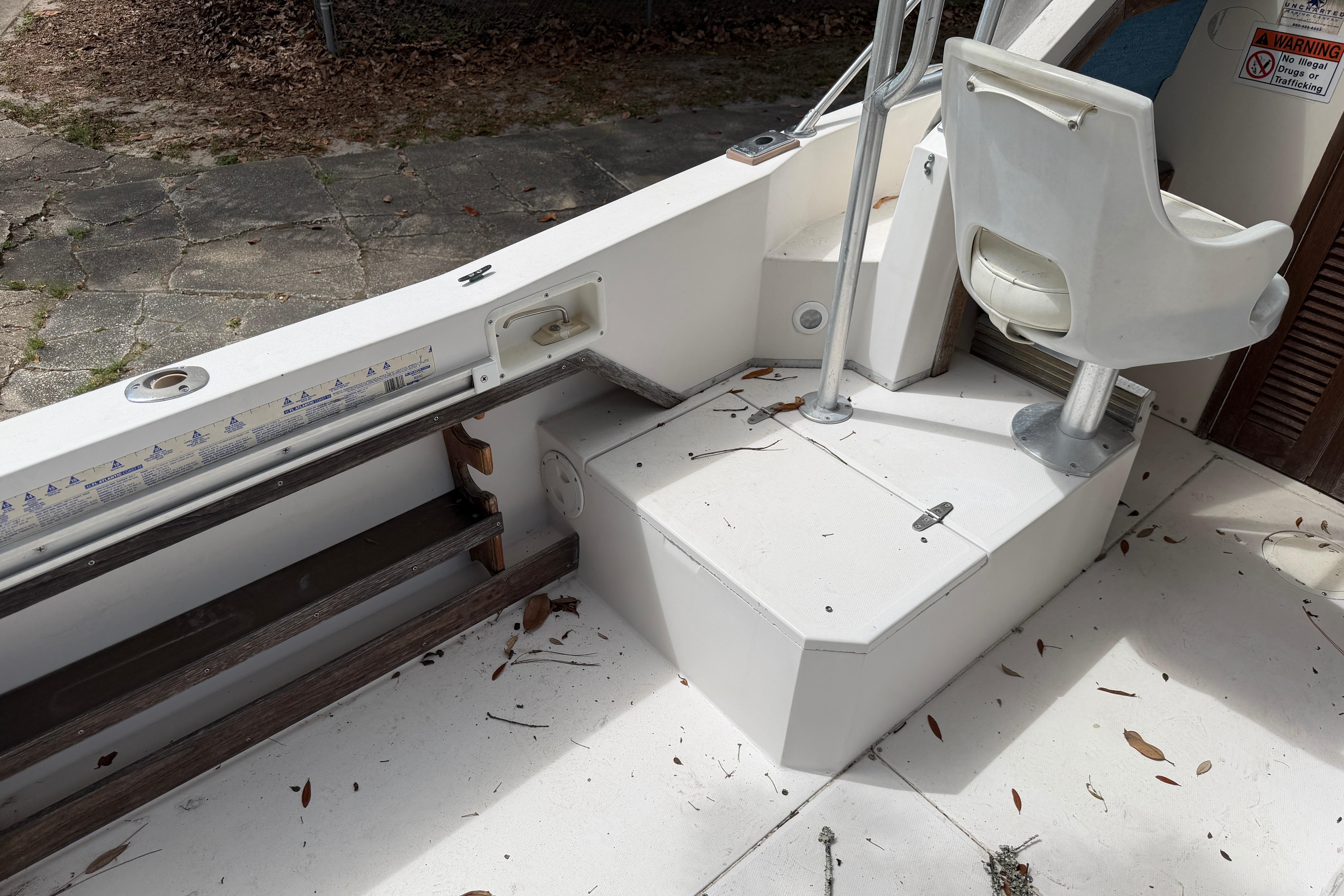 1987 Grady-White Seafarer 226 boat interior with seating and storage area.