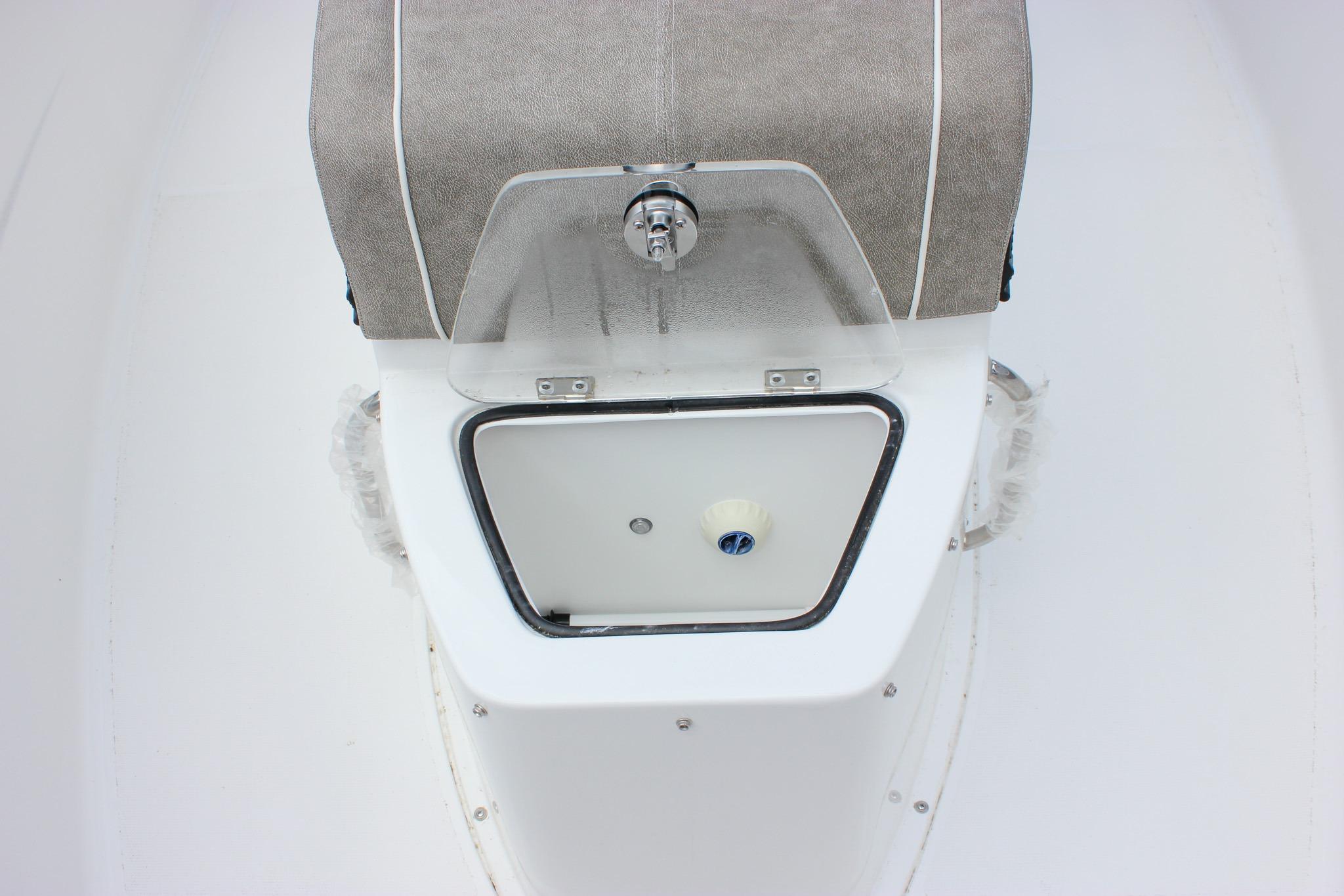 Sea Hunt Ultra 275 Coffin Box 2027, featuring a sleek storage compartment design.