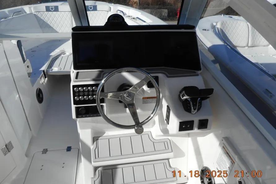 Helm of 2026 Sea Fox 268 Traveler boat with steering wheel and controls.