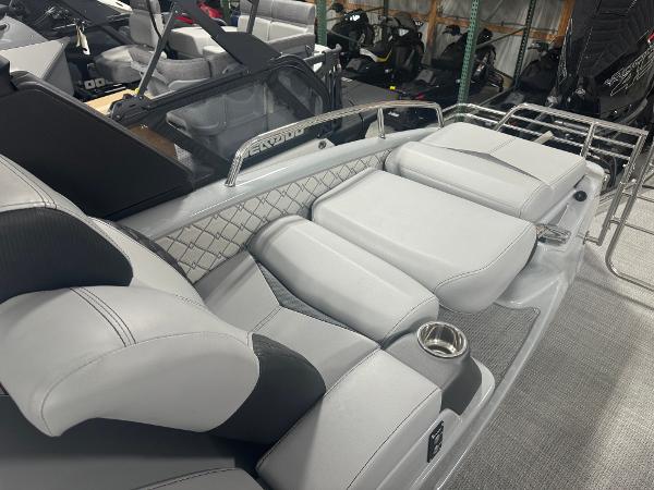 2025 Manitou LX boat interior with luxurious gray seating and modern design.