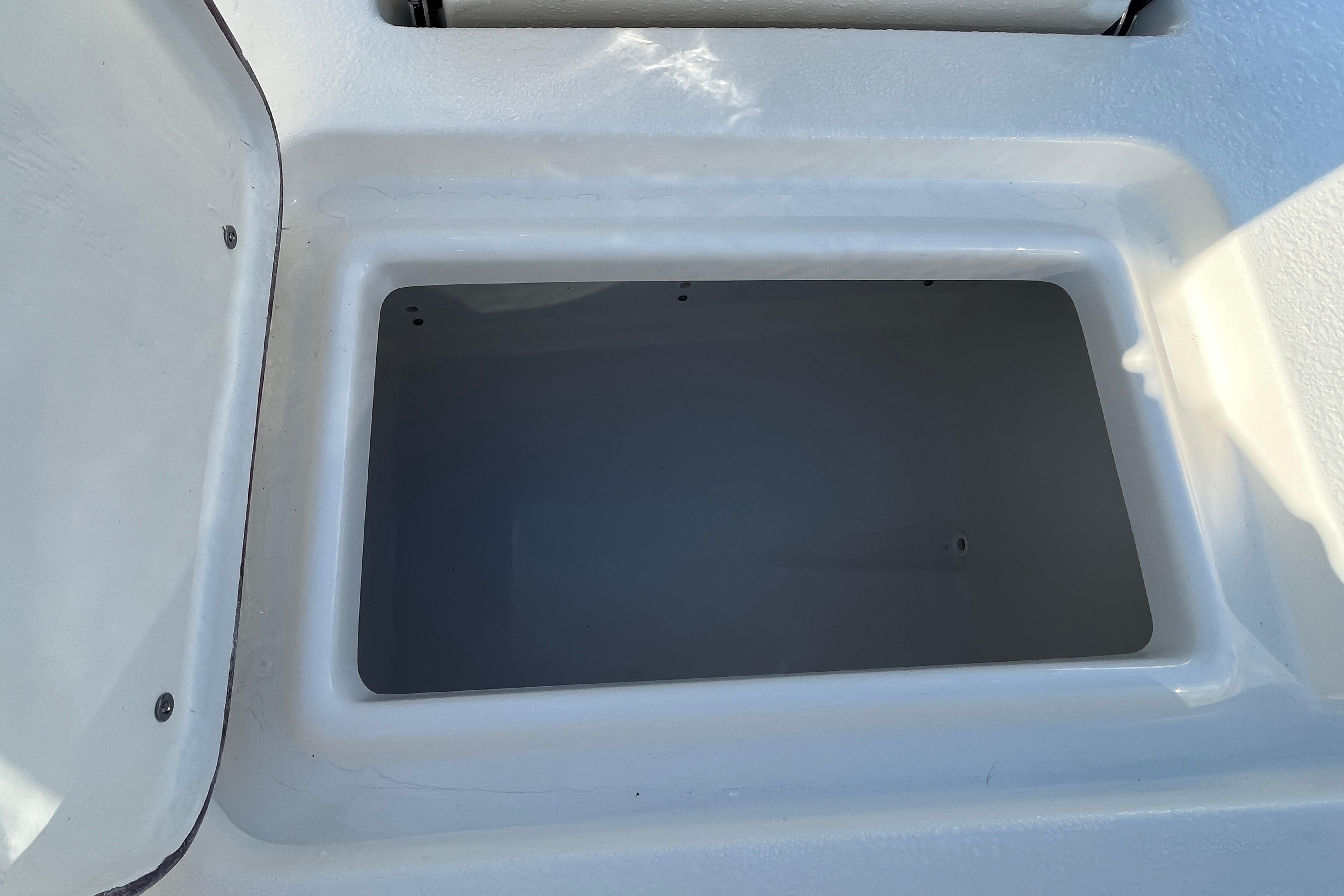 Storage compartment of 2026 Bulls Bay 2200 boat, open and empty.