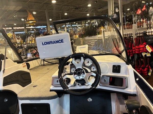 2023 Nitro ZV20 Pro boat dashboard with Lowrance navigation system in showroom.