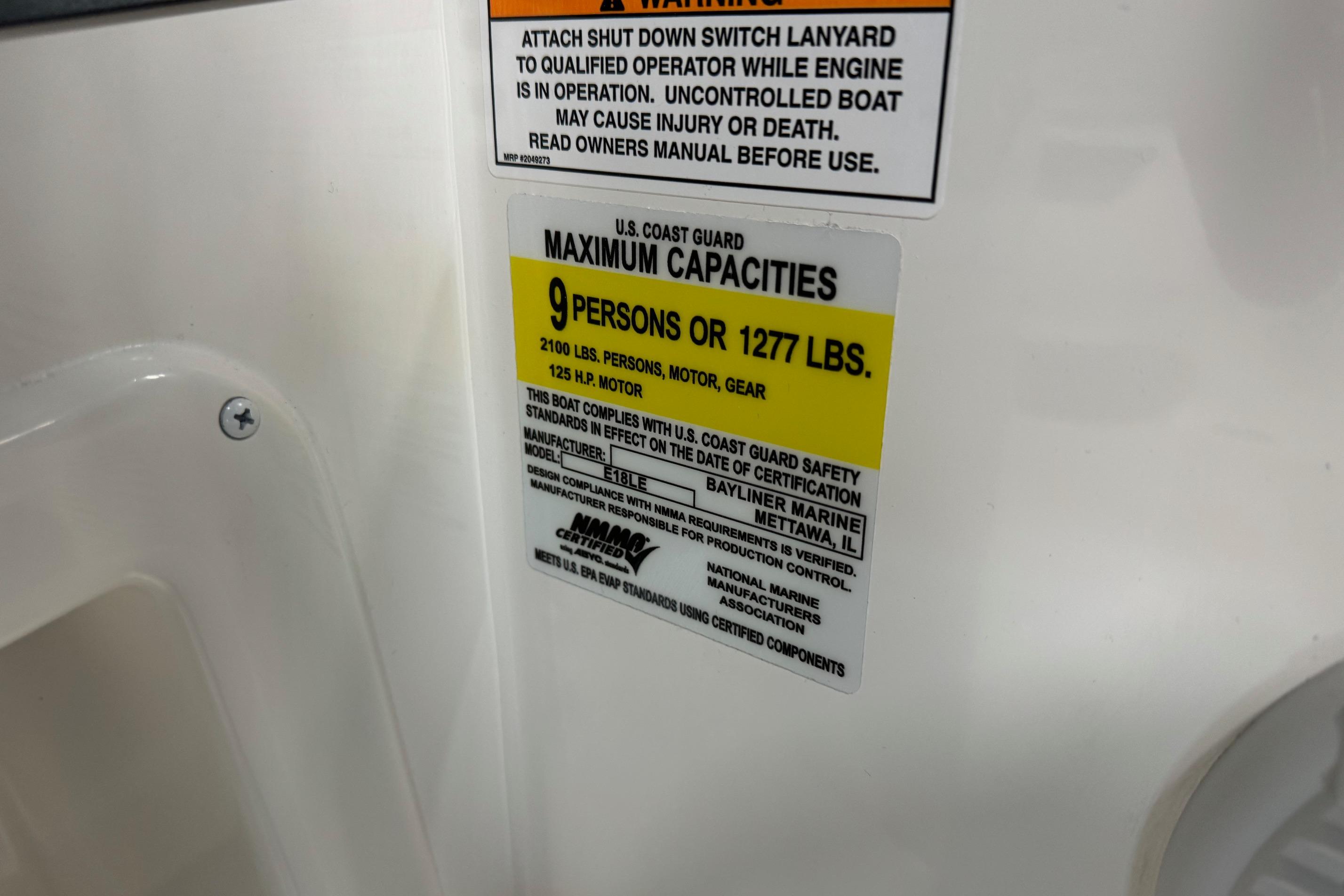 2025 Bayliner Element E18 capacity label, max 9 persons or 1277 lbs, 125 HP motor.