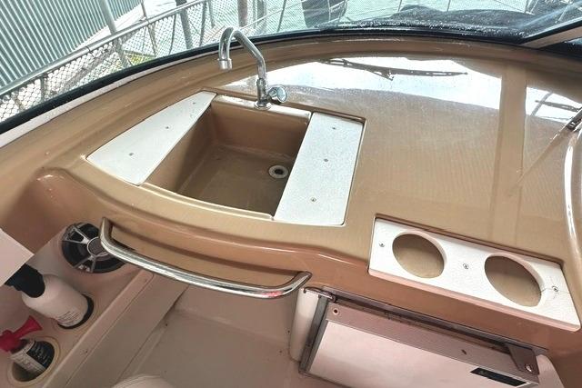 2004 Carver 360 Mariner boat sink and countertop with cup holders.