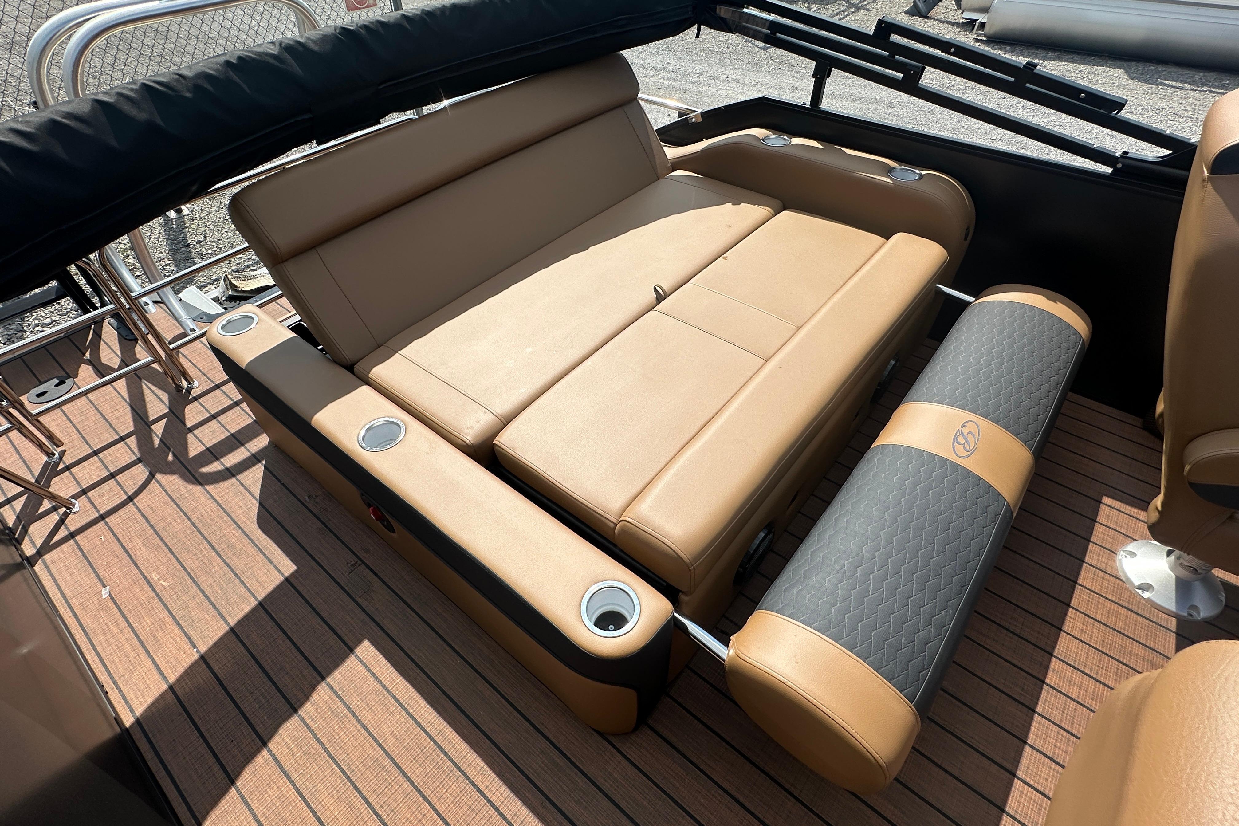 2025 Bentley Pontoons 223 Elite Swingback interior with tan seating and cup holders.
