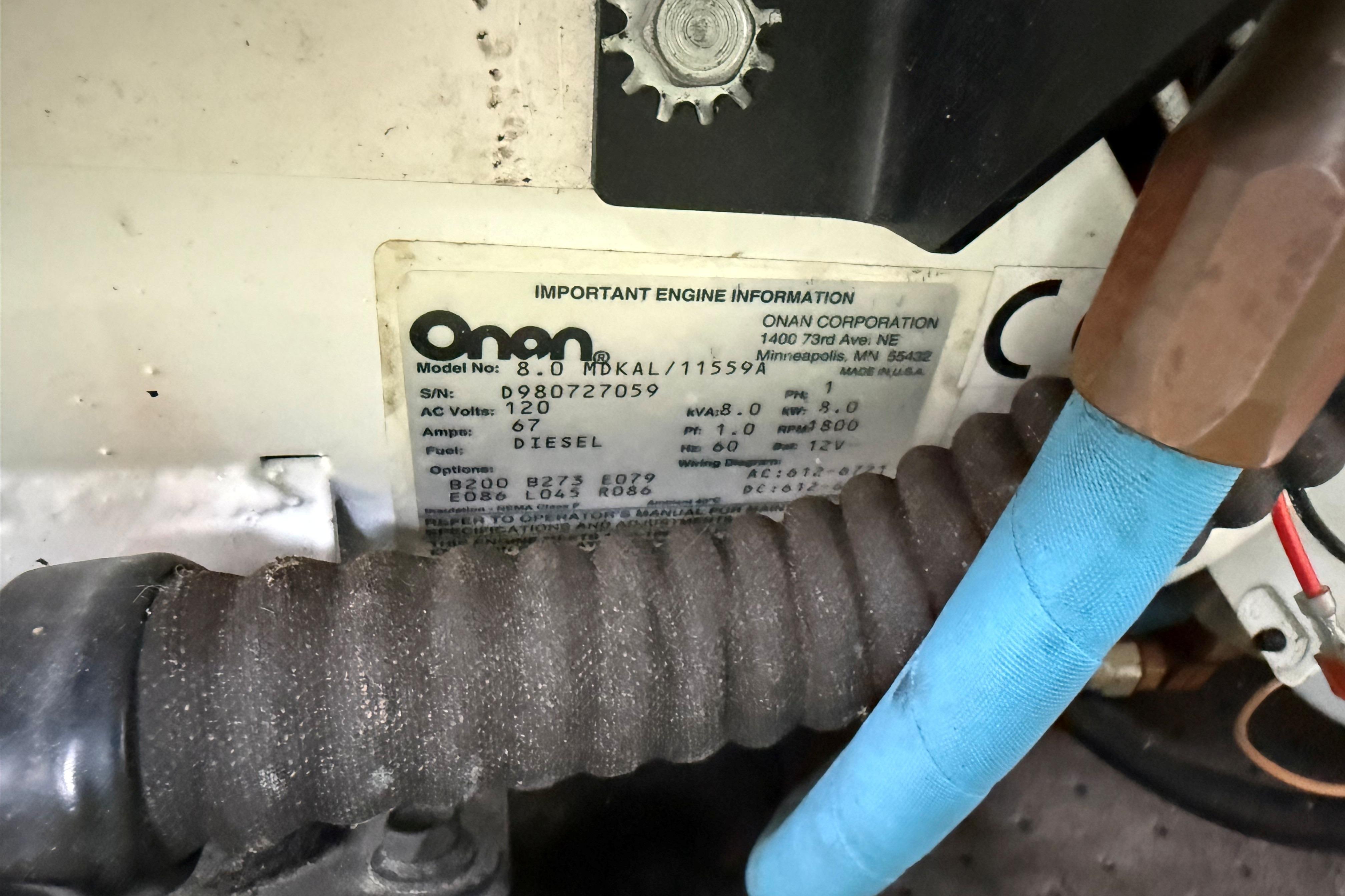 Close-up of Onan generator label on 1999 Mainship 350 Trawler, showing model and specifications.