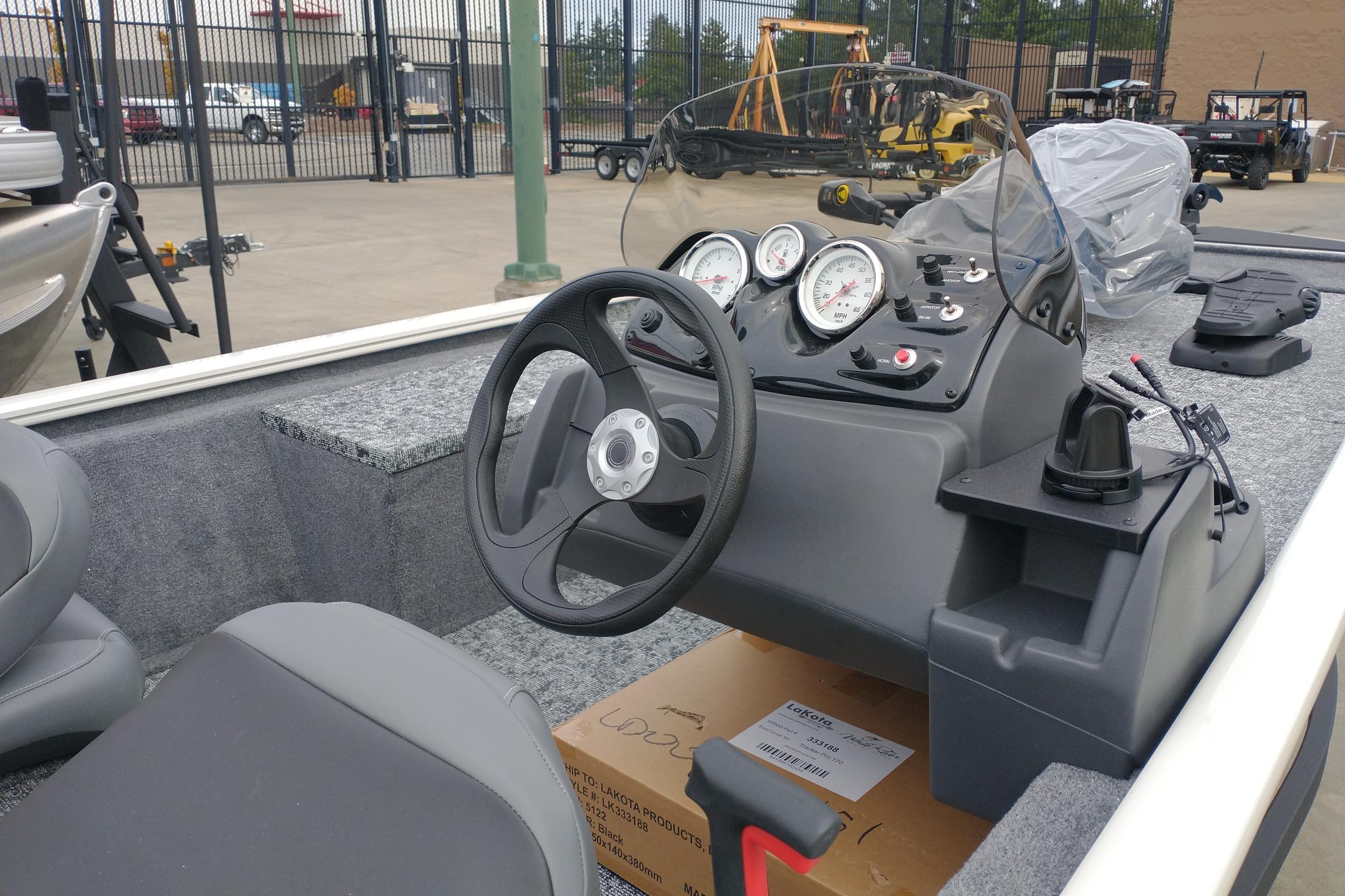 2026 Tracker Pro 170 boat interior with steering wheel and dashboard gauges.