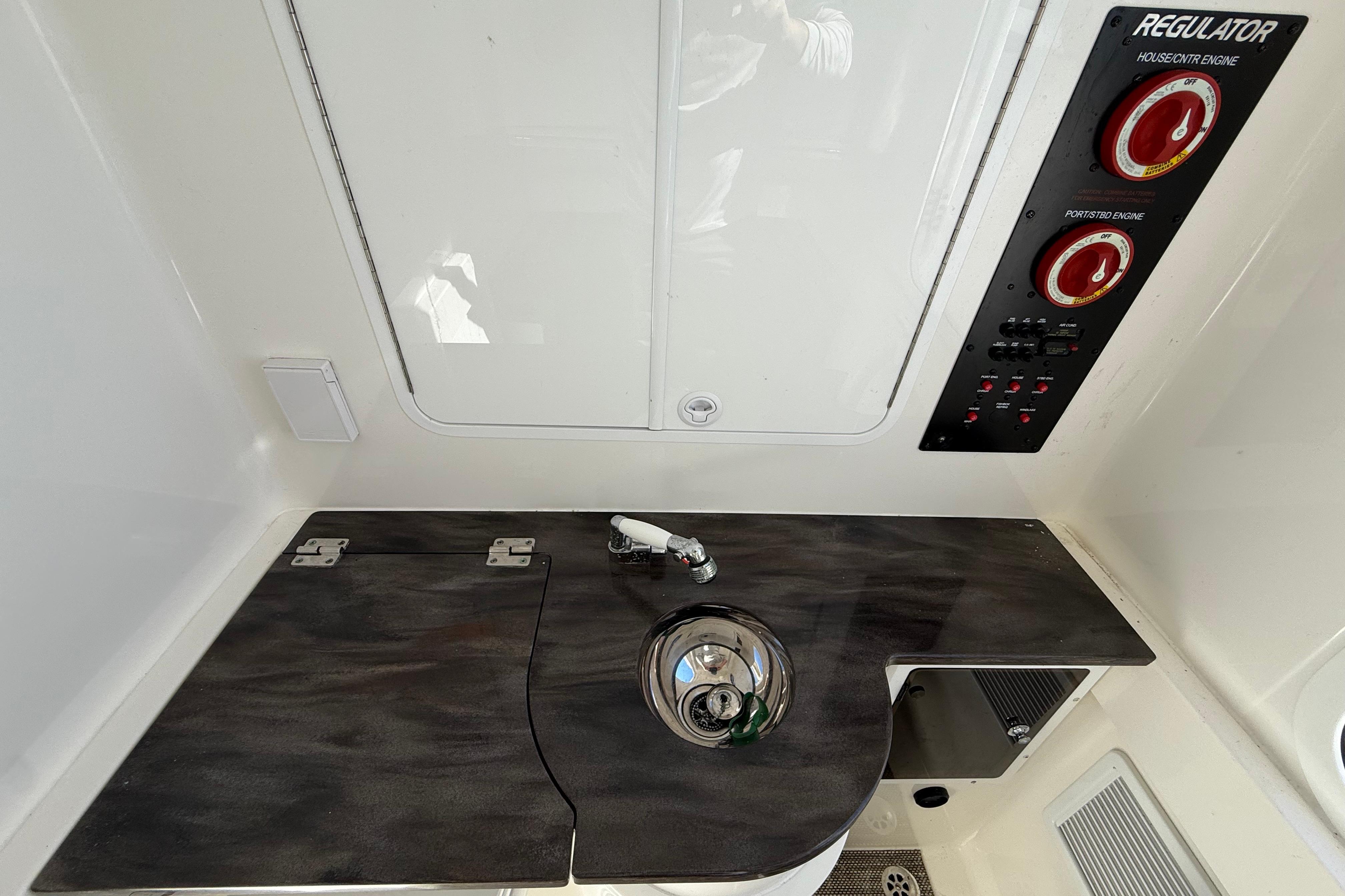 2022 Regulator 34 boat interior with control panel and sink area.