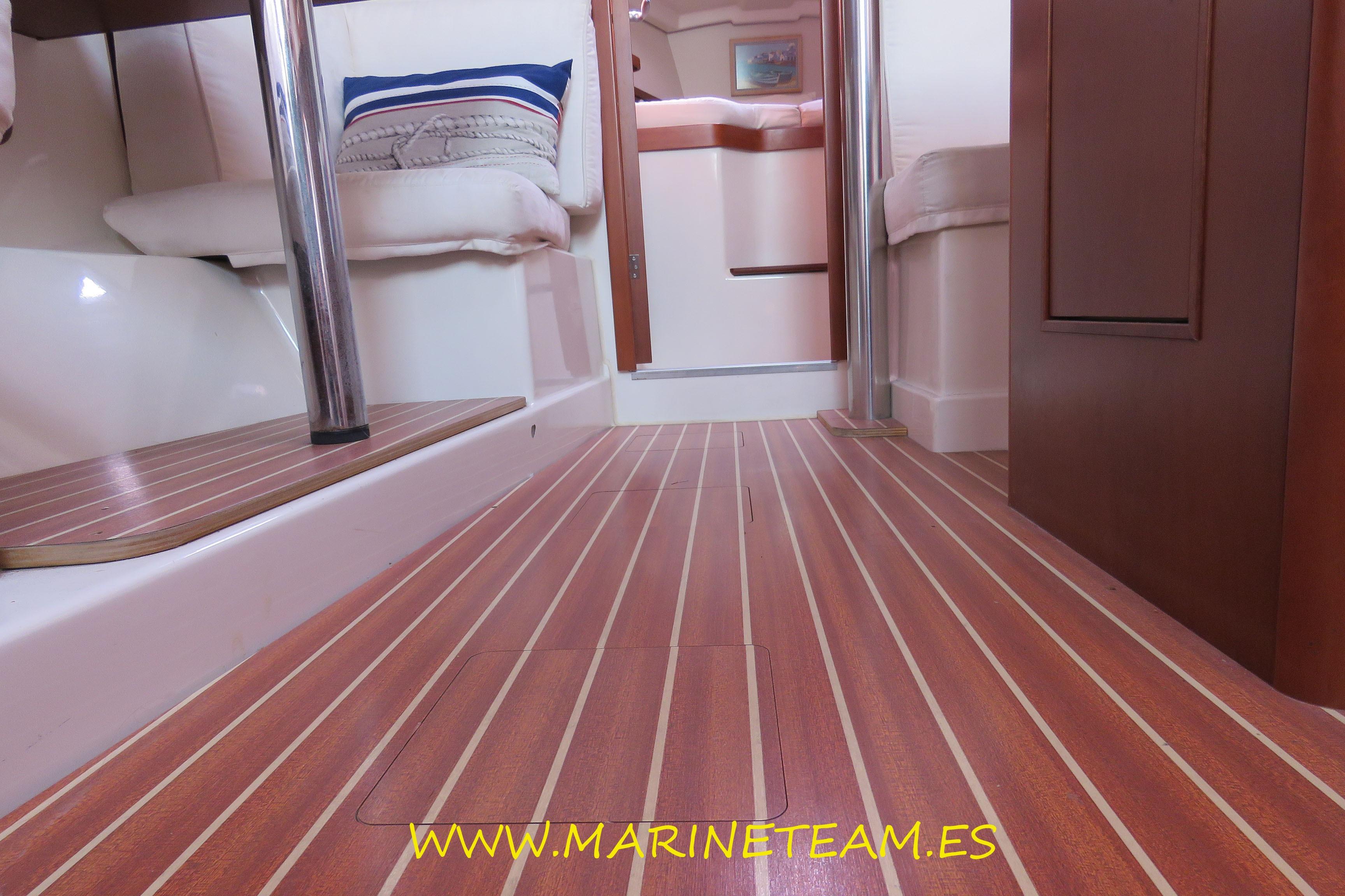 Interior of 2007 Hanse 342 yacht with wooden flooring and cozy seating area.