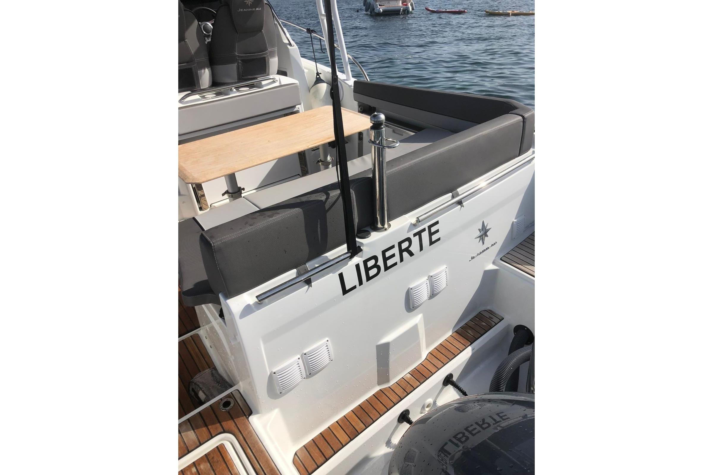 2020 Jeanneau Cap Camarat 9.0 WA boat with "LIBERTE" name, docked on water.