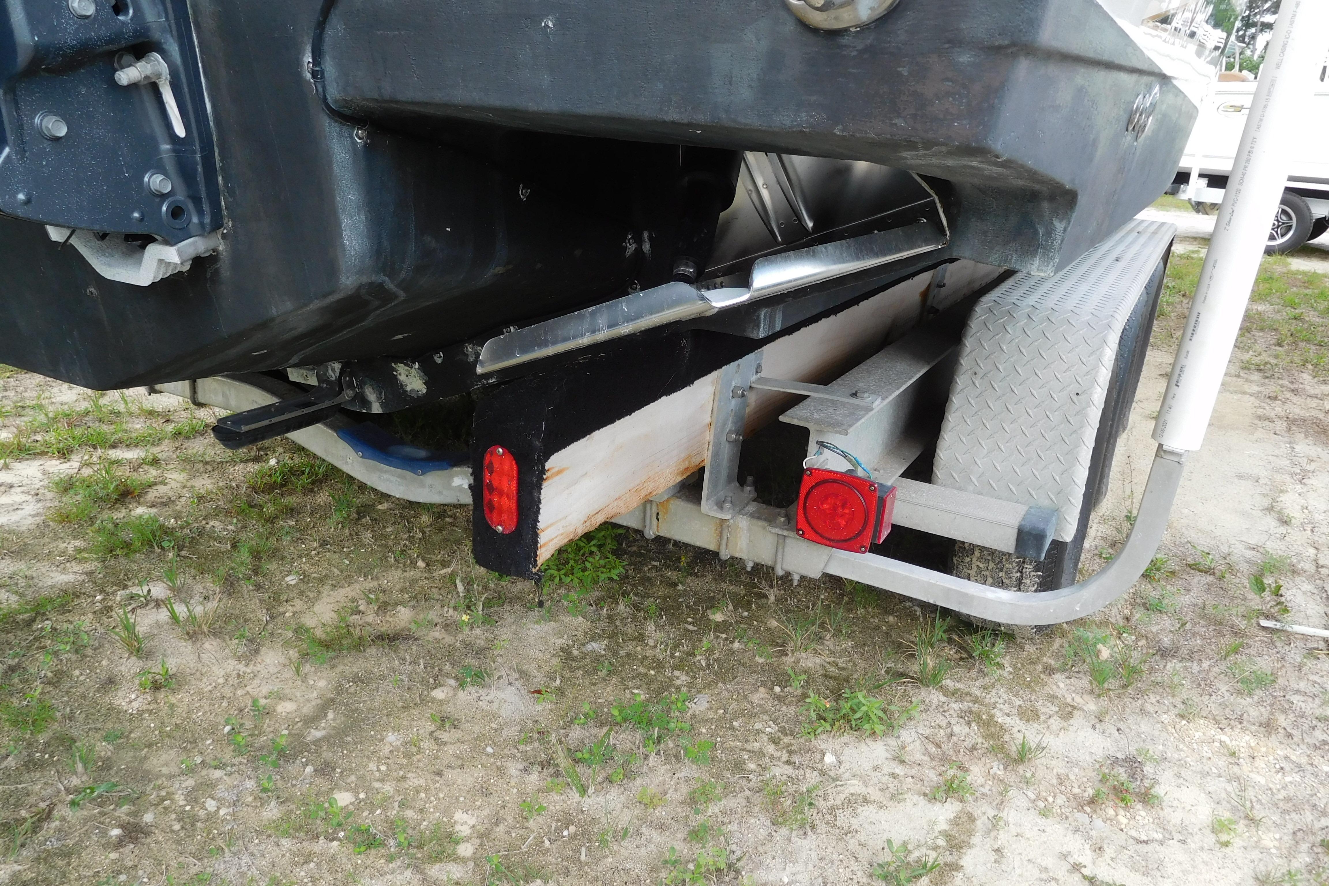 2003 Hydra-Sports Vector 2800 CC boat on trailer, rear view with visible taillights.
