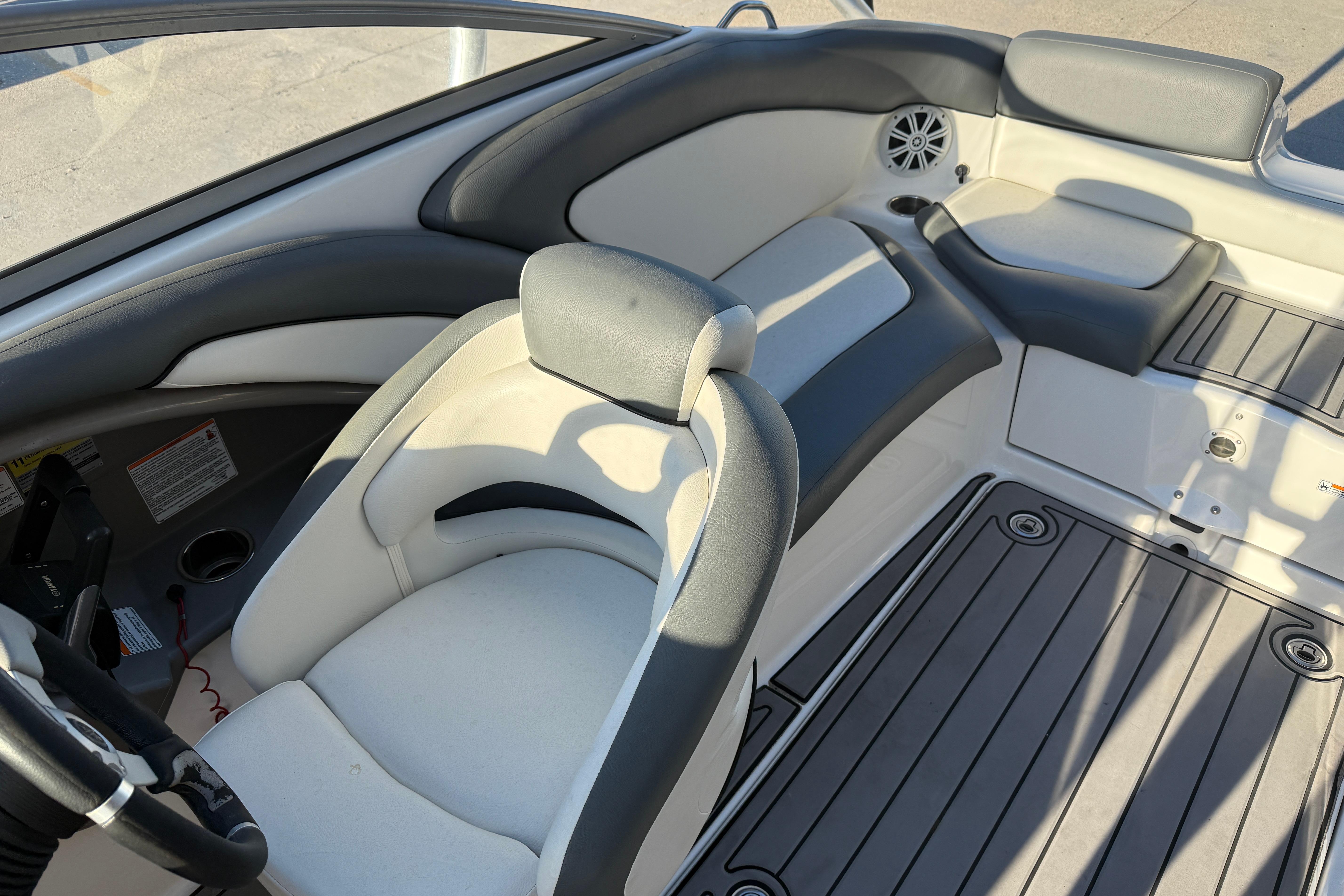 Interior of 2011 Yamaha Boats 242 Limited S, featuring sleek seating and modern design.