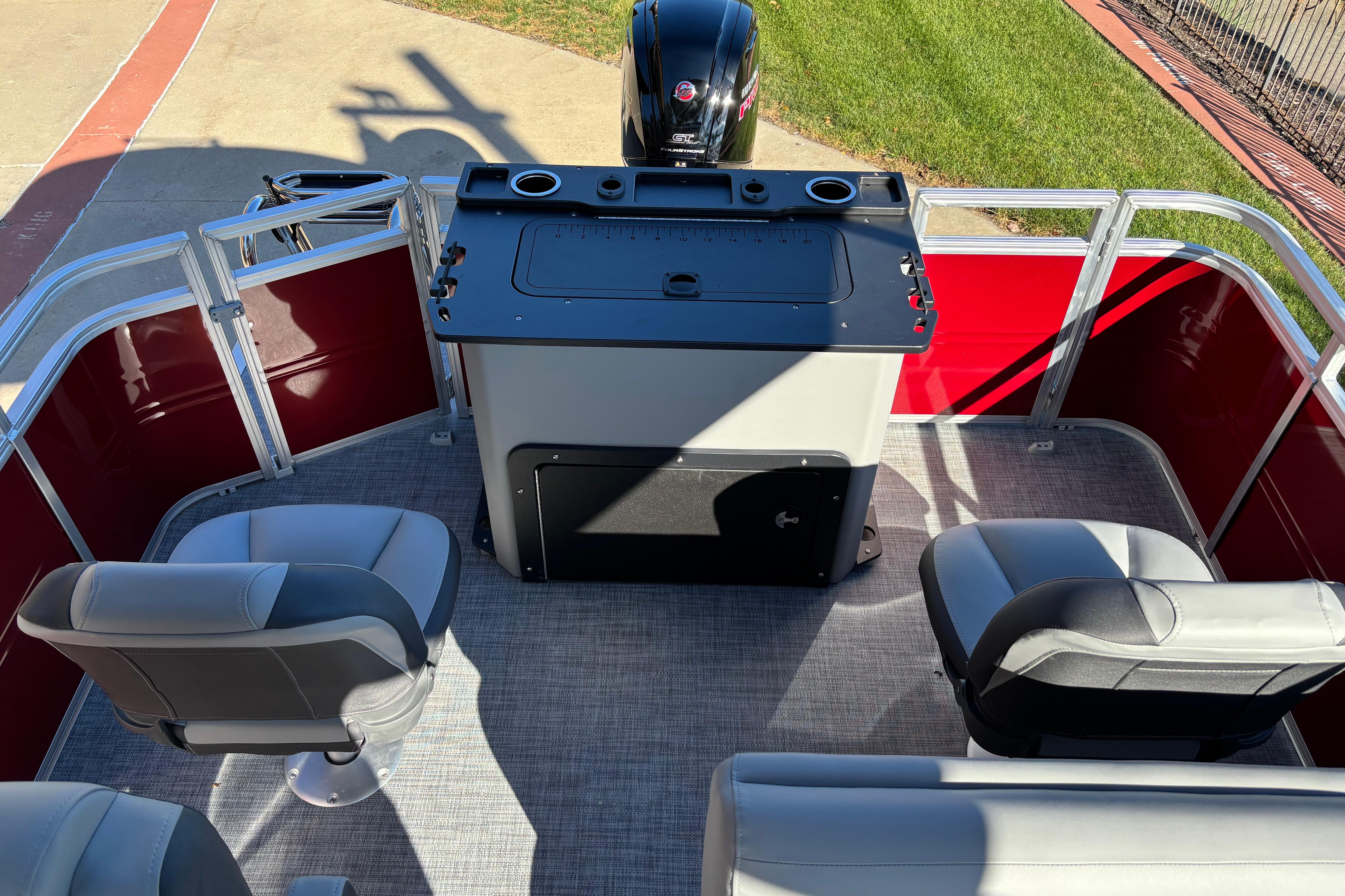 2026 Sun Tracker SportFish 20 DLX interior with seating and control panel.