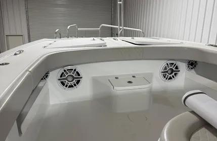Interior view of a 2022 Freeman 43 boat, featuring speakers and seating.