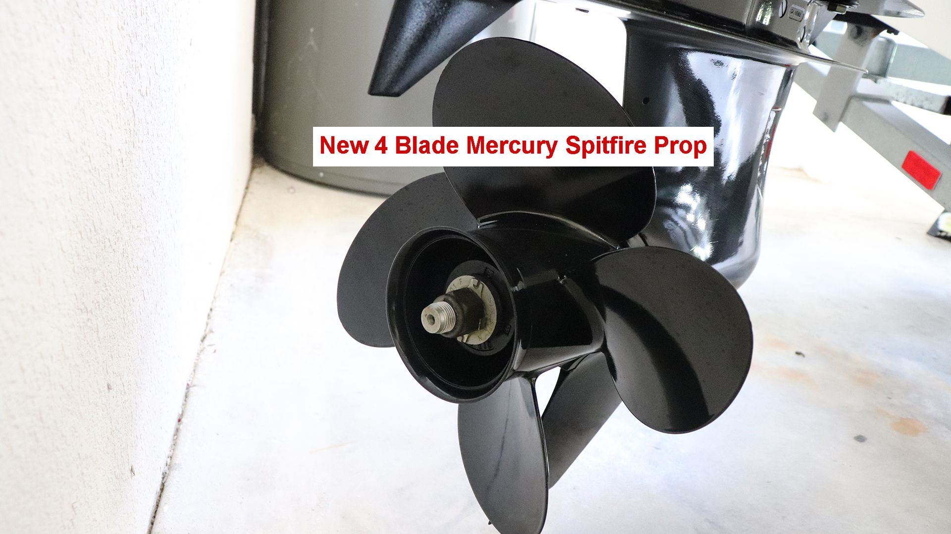 New 4-blade Mercury Spitfire propeller on a boat motor.