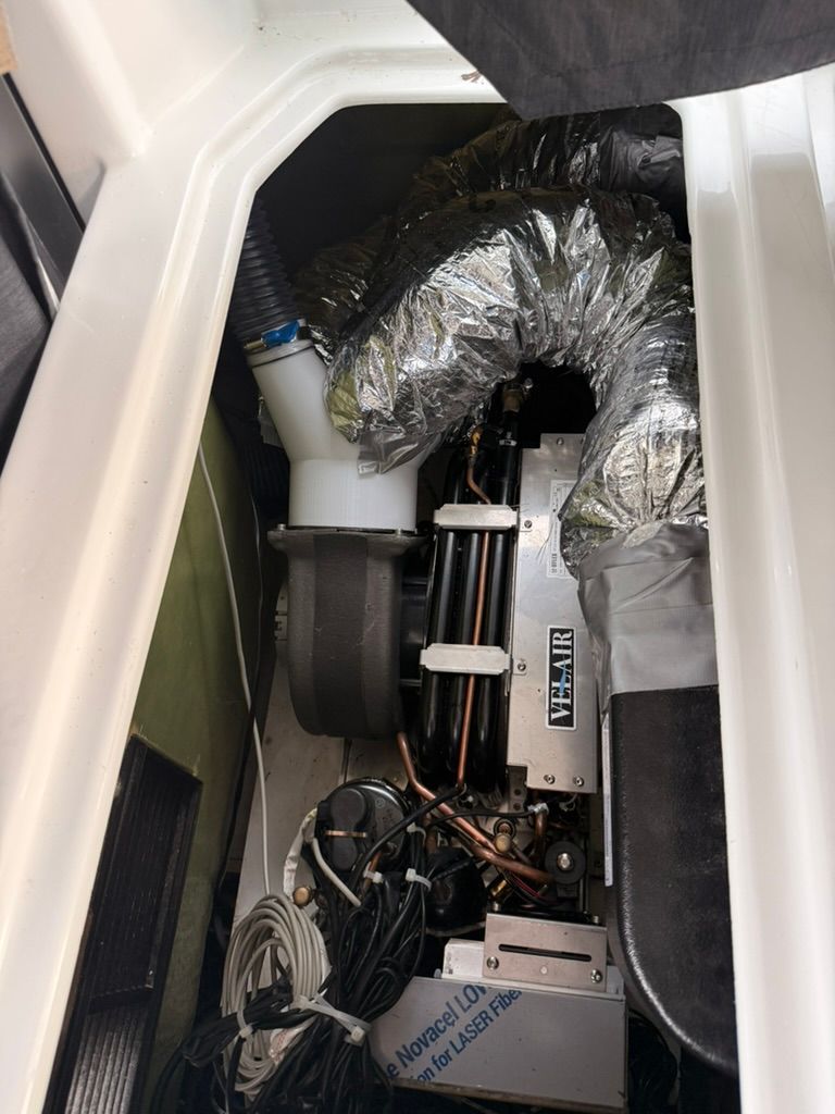 Engine compartment of the 2020 Beneteau Antares 9 OB with technical components.