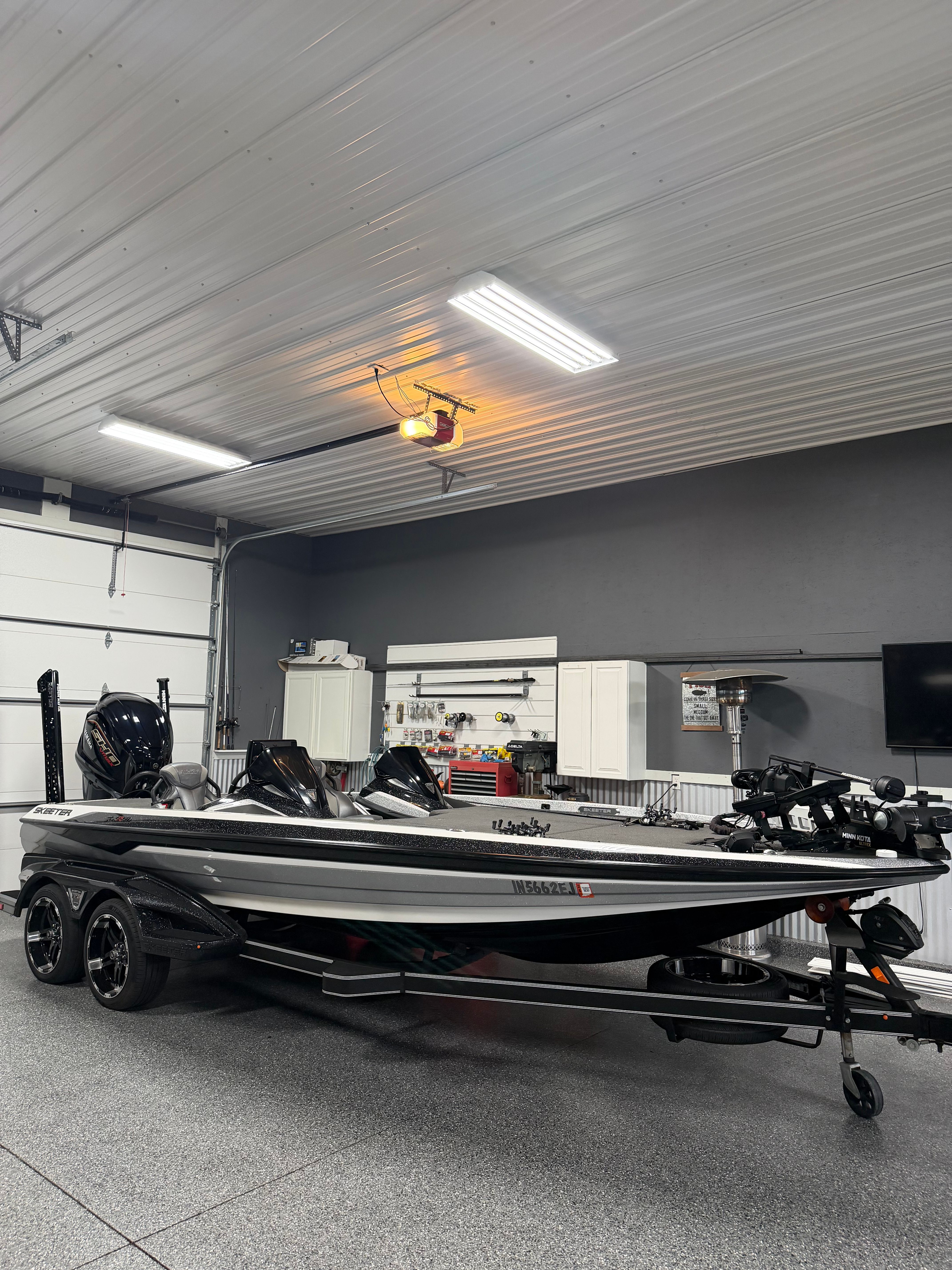 A 2022 Skeeter FXR21 Limited boat is parked in a garage.