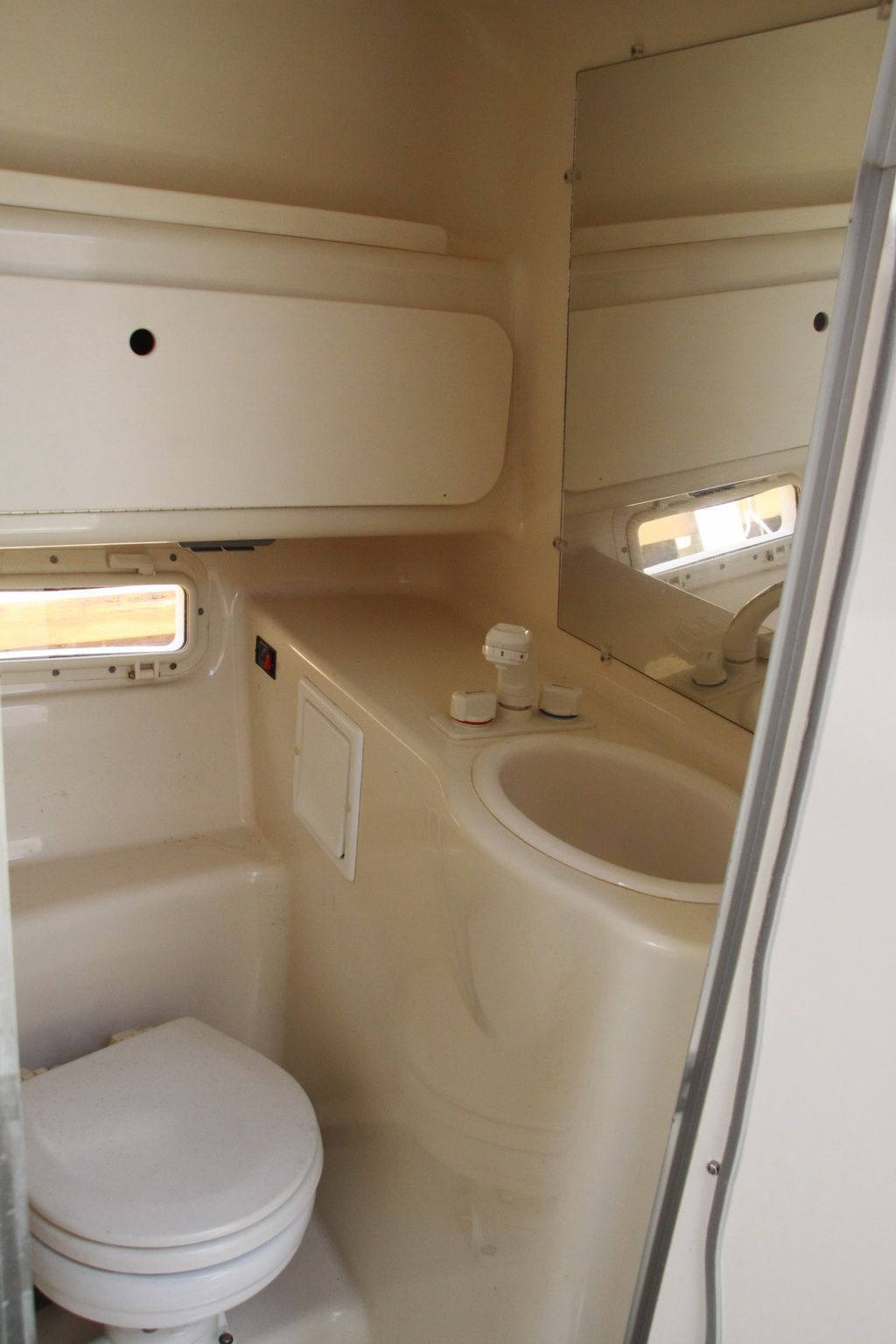 Interior of a 1999 Maxum 2400 Mercruiser boat bathroom.