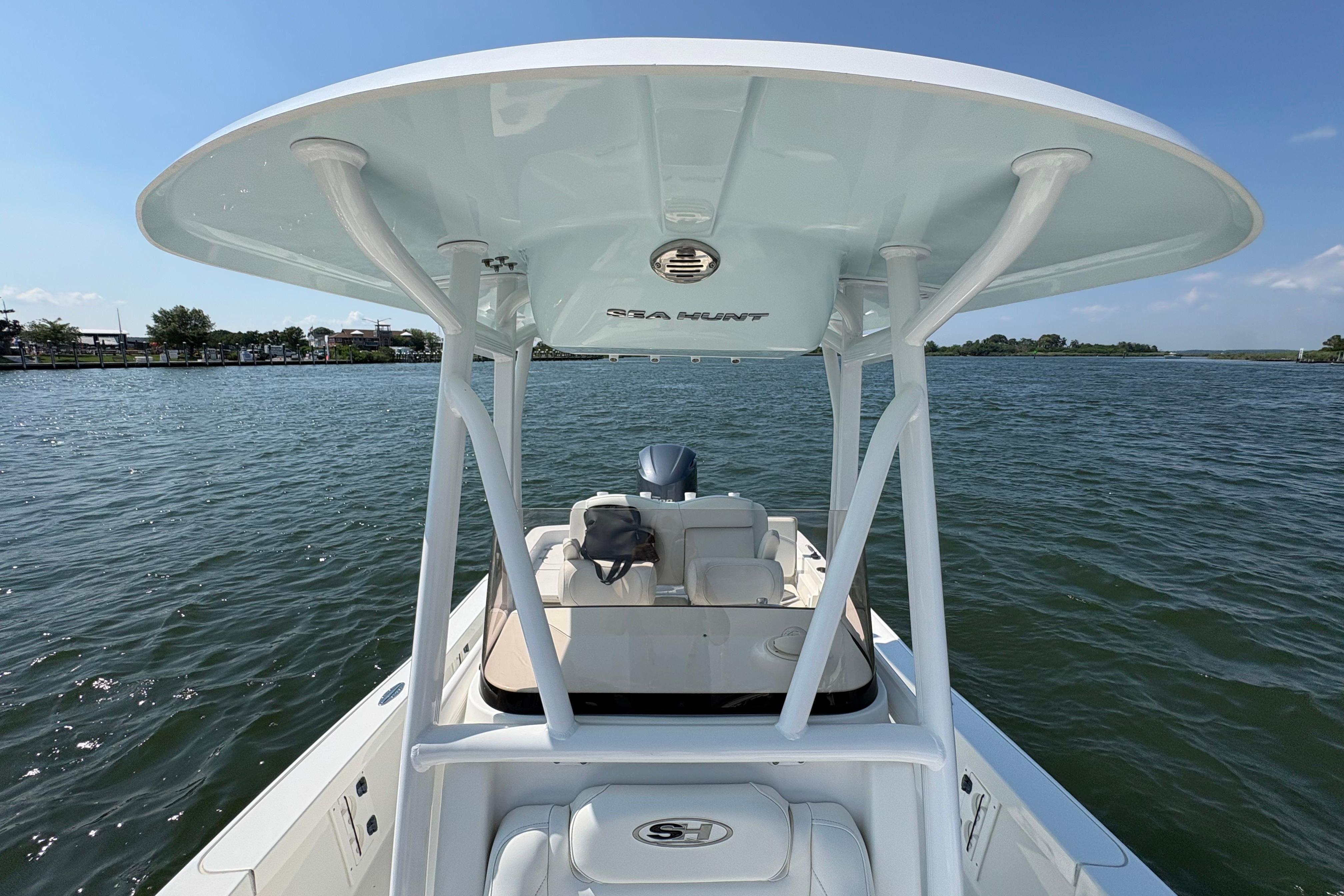 2017 Sea Hunt BX 25 BR boat on calm water, featuring a sleek design and spacious deck.